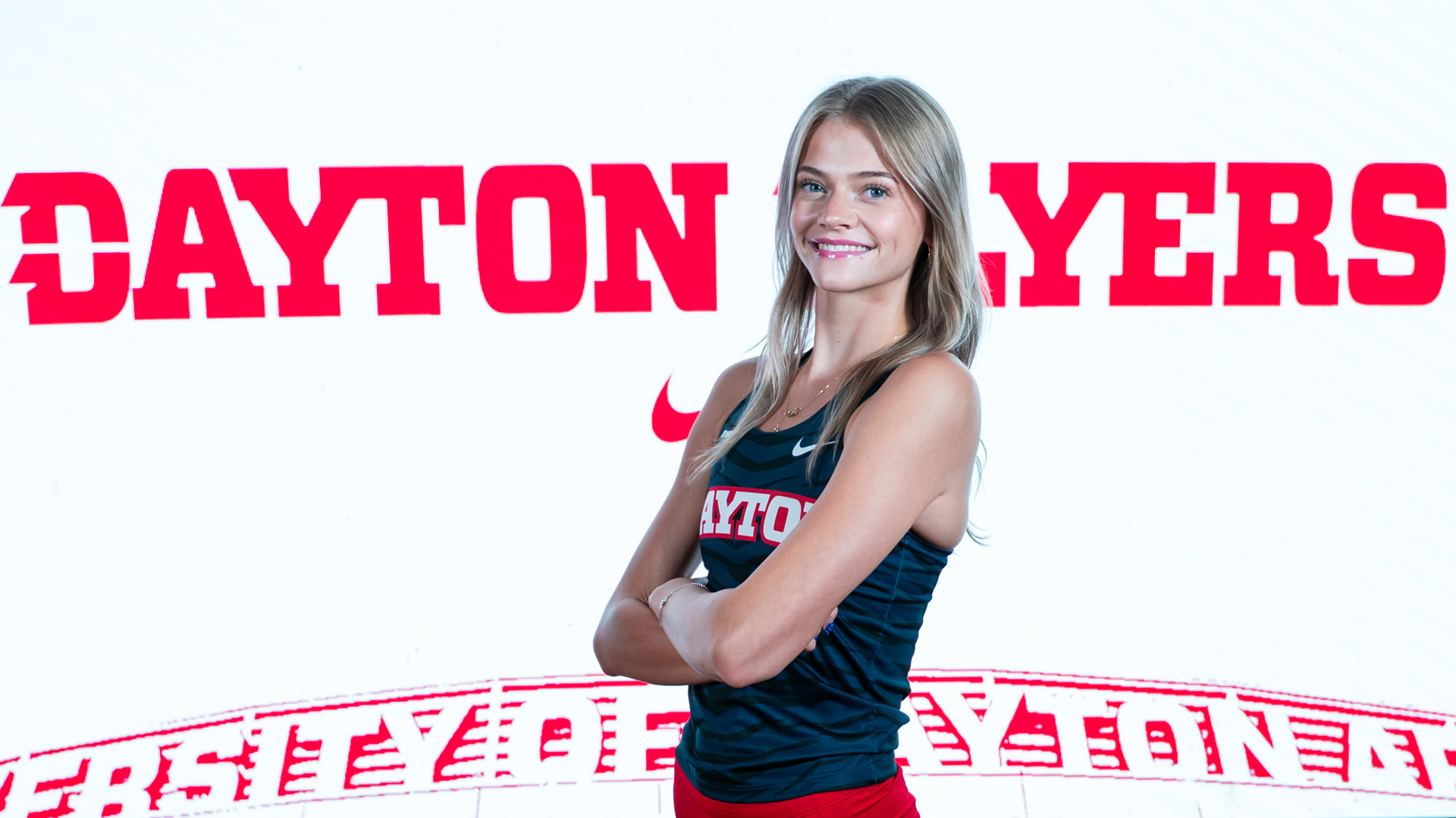 Camryn Thompson smiles for the camera on Track and Field Content Day