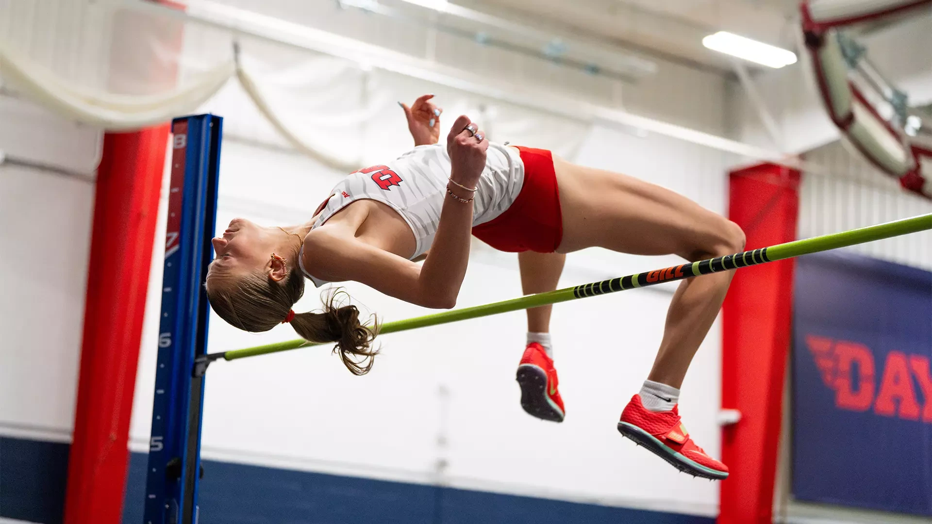 Camryn Thompson clears the bar practicing the high jump in the Joe Owens Center
