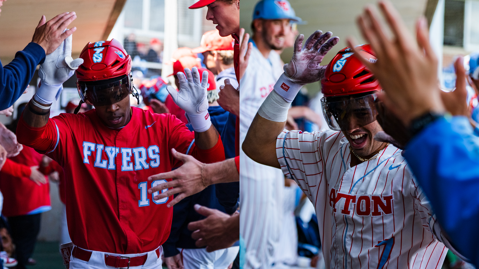Michael Smith Jr., wearing a red uniform, and Jason Bello, wearing a white pinstripe uniform, run through the dugout with a red hockey helmet on to celebrate a home run.