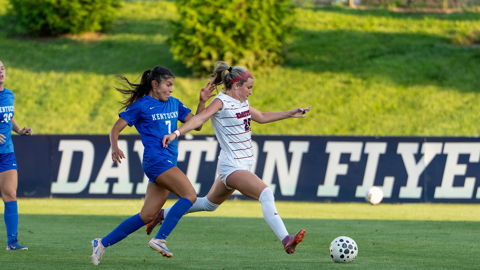 Dayton women's soccer player Laney Smith dribbles by a Kentucky defender.