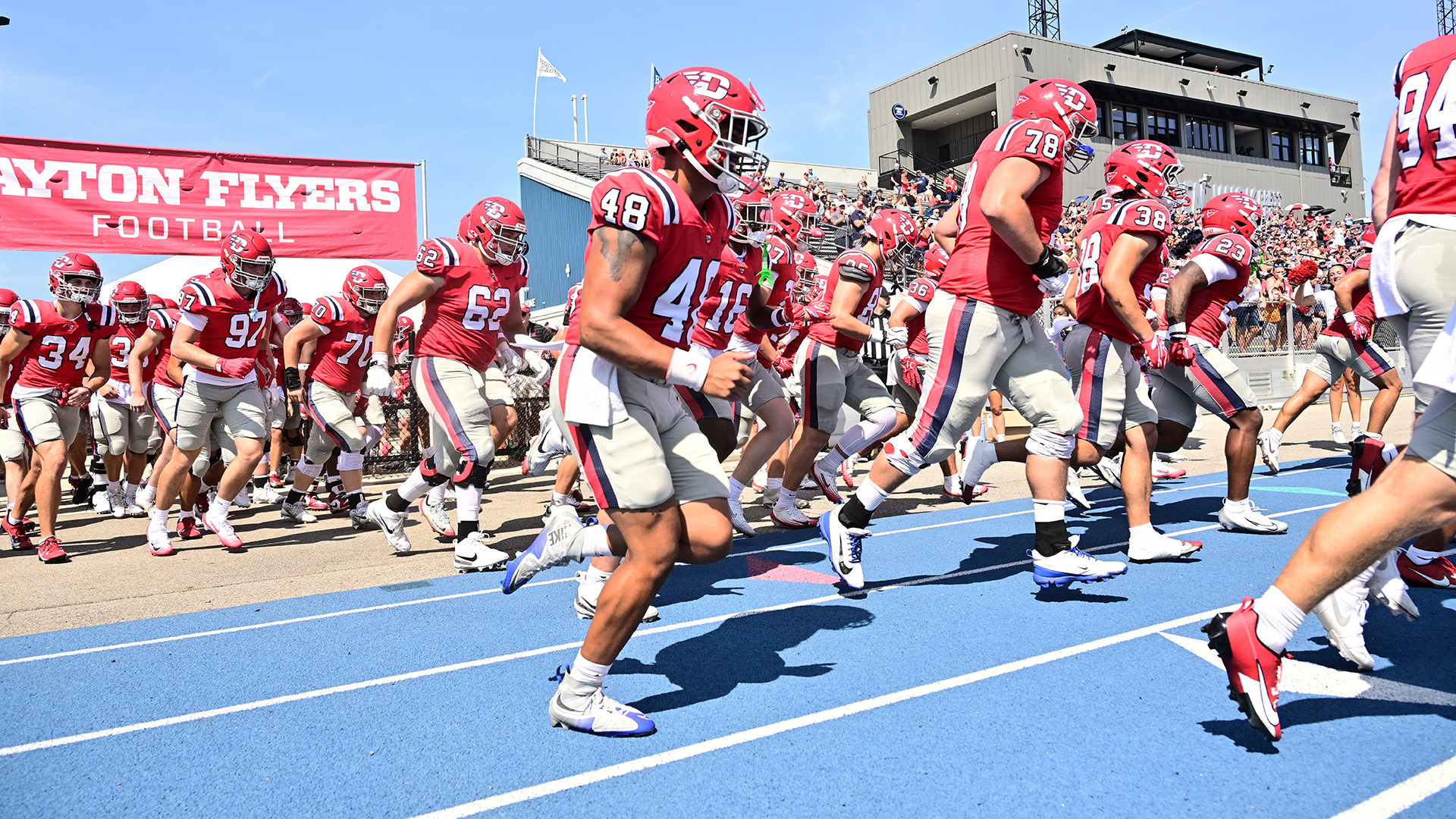 The team walking out to the field