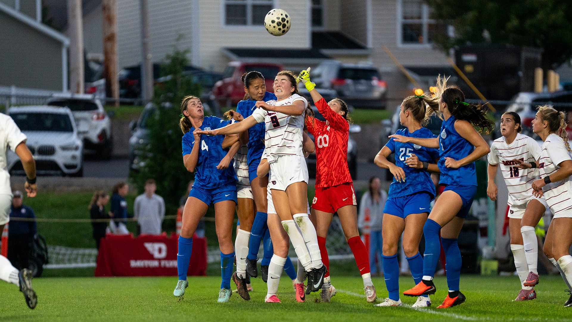 University of Dayton Women's Soccer Player Reece Gallagher heads a ball against Saint Louis