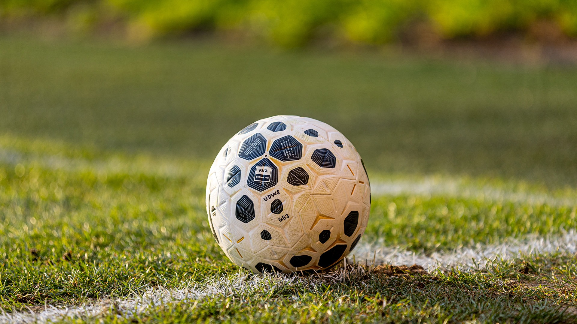 A generic photo of a women's soccer ball on a soccer field