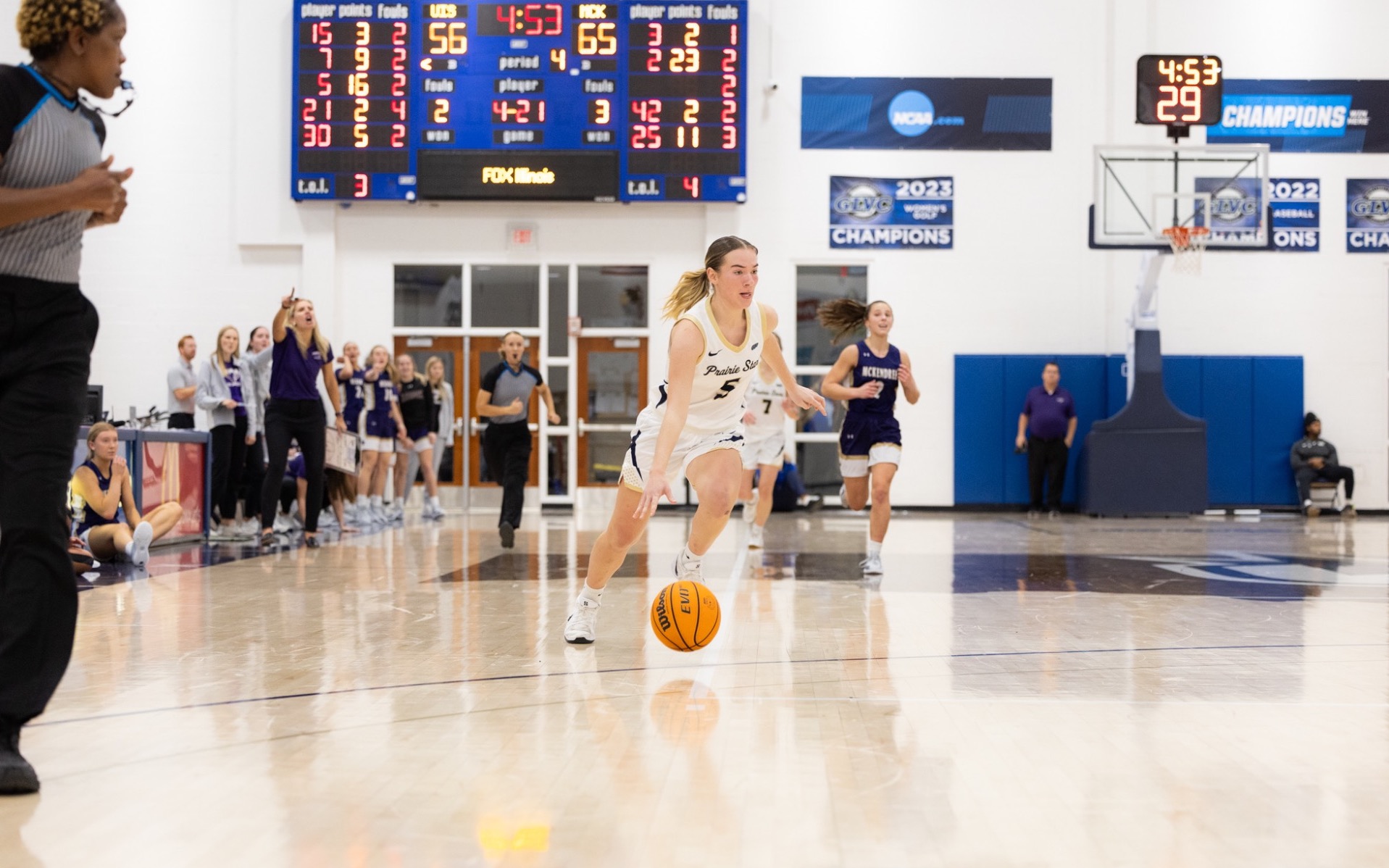 Julia Mingus dribbles down the court