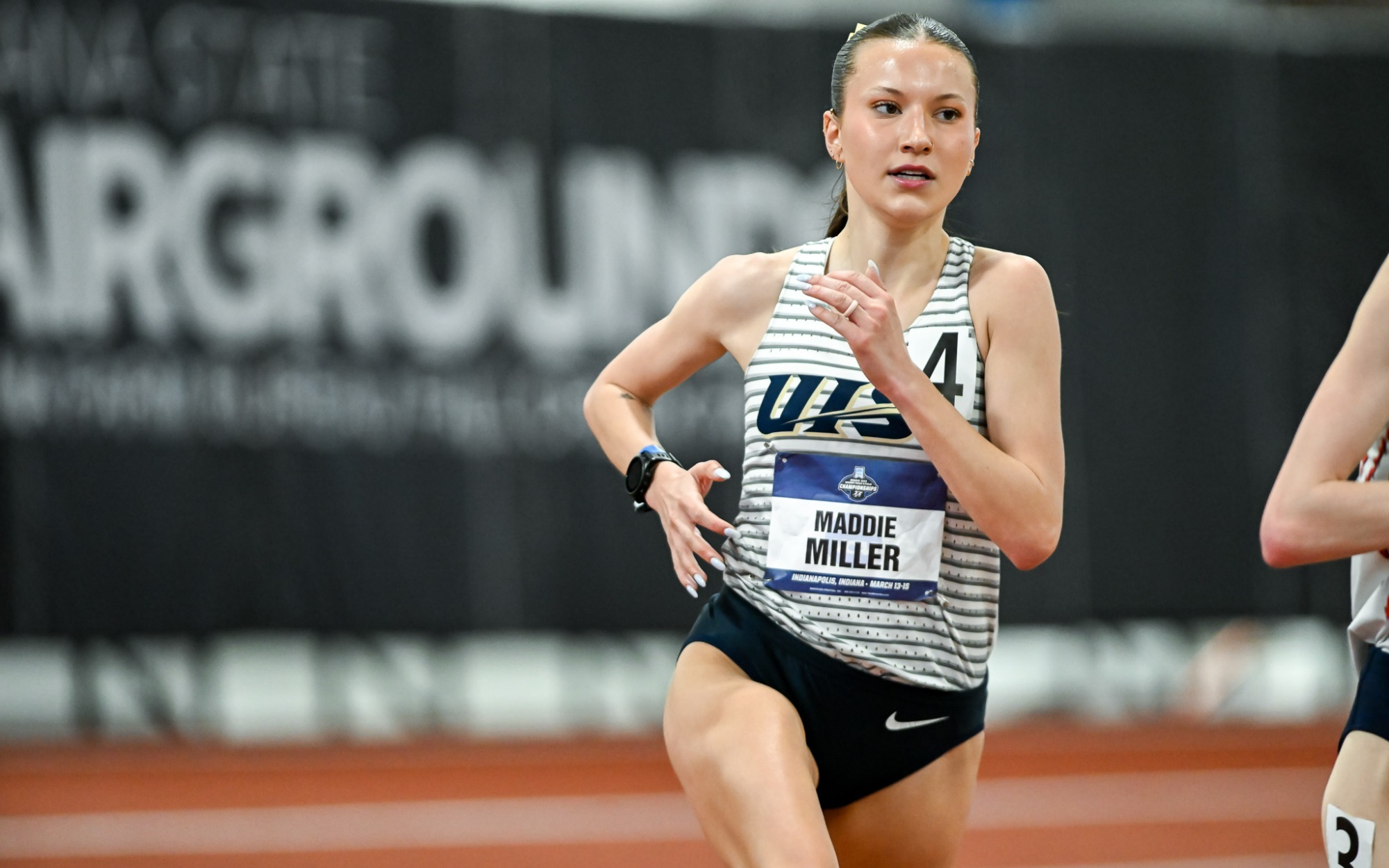 Maddie Miller racing indoor track