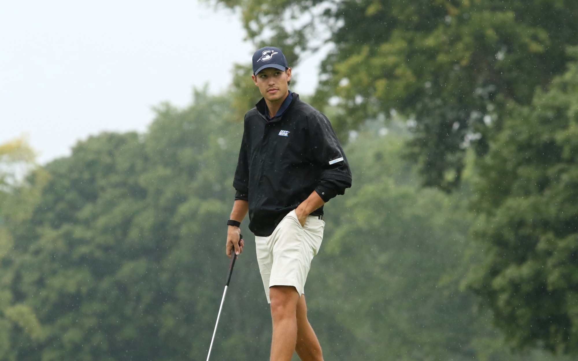 Julien Babineau golfing in rain