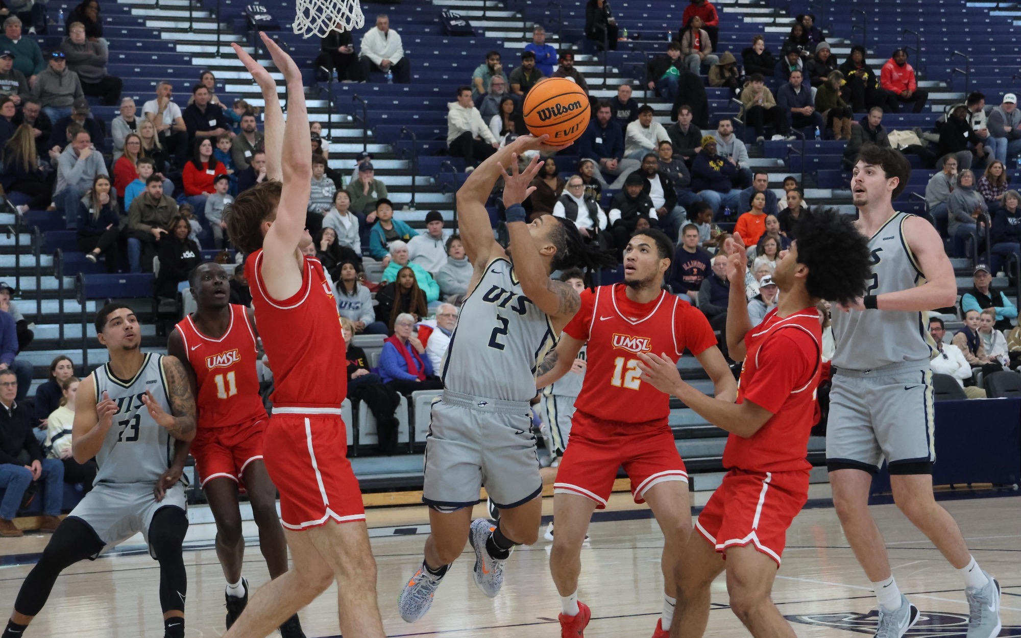 Jordan Rice playing basketball at UIS