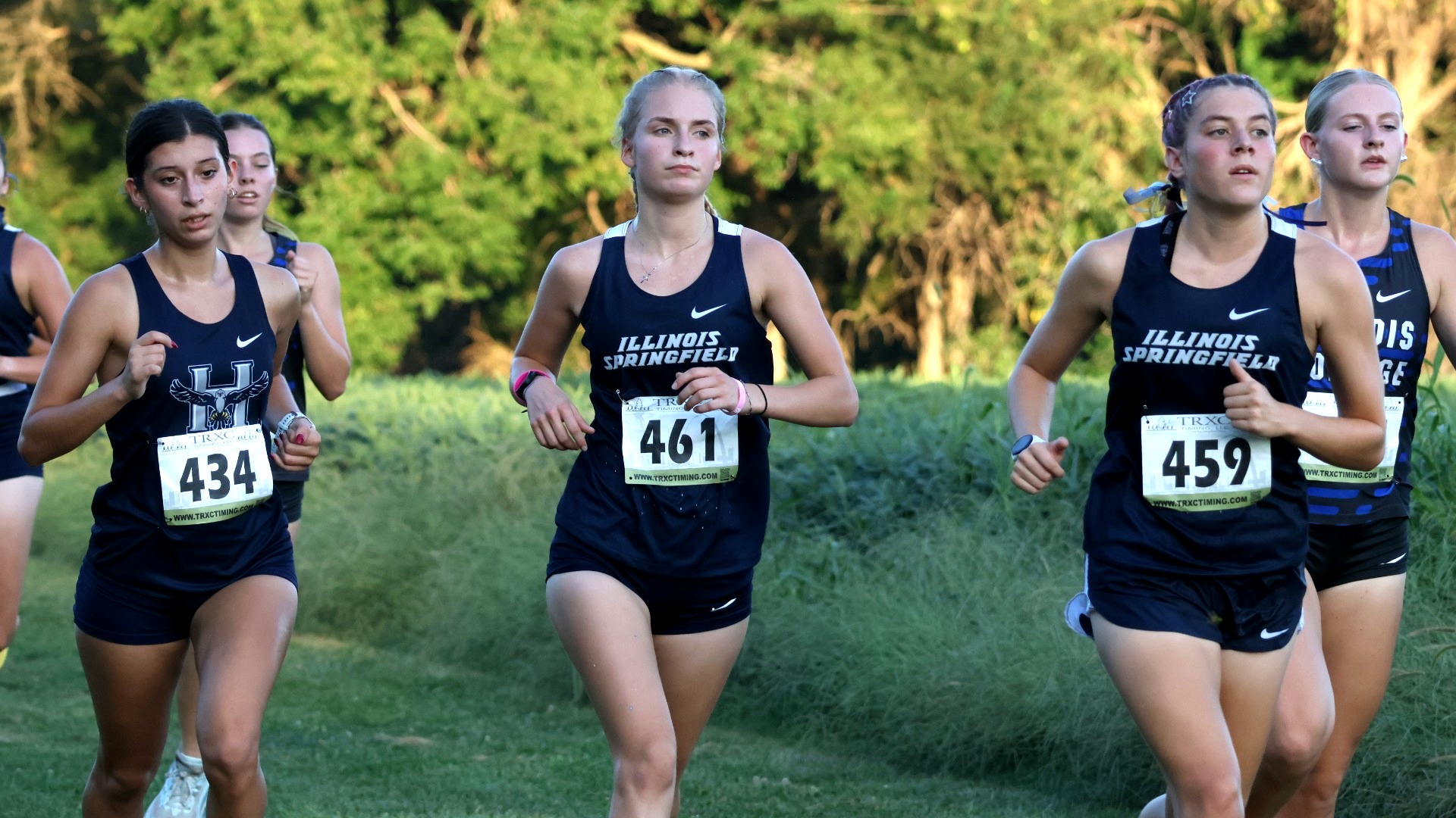 Lacey Updike and Allison Thompson running cross country
