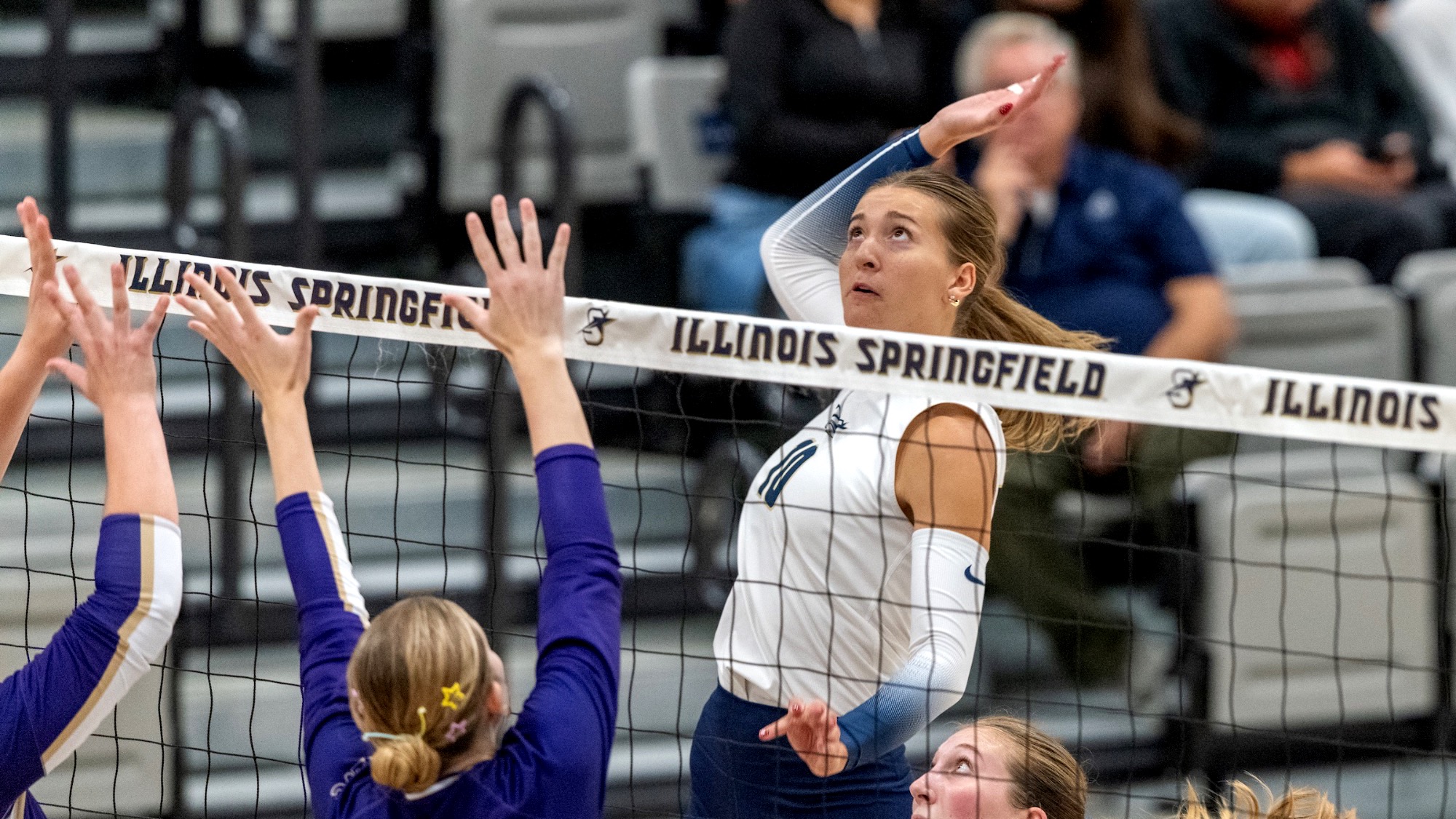 Alexis Schwartz goes up for a kill in volleyball match