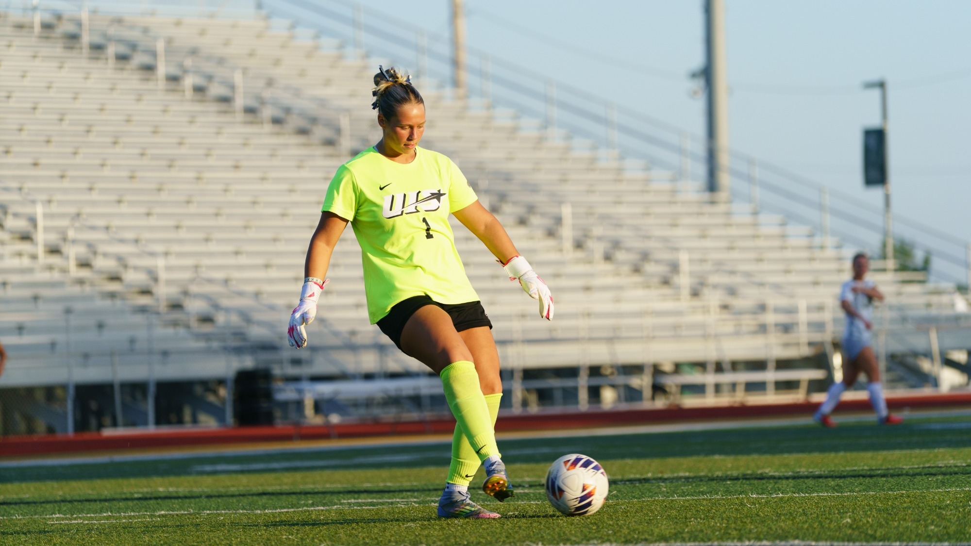 Gigi Yurevich, UIS women's soccer goalkeeper in yellow uniform