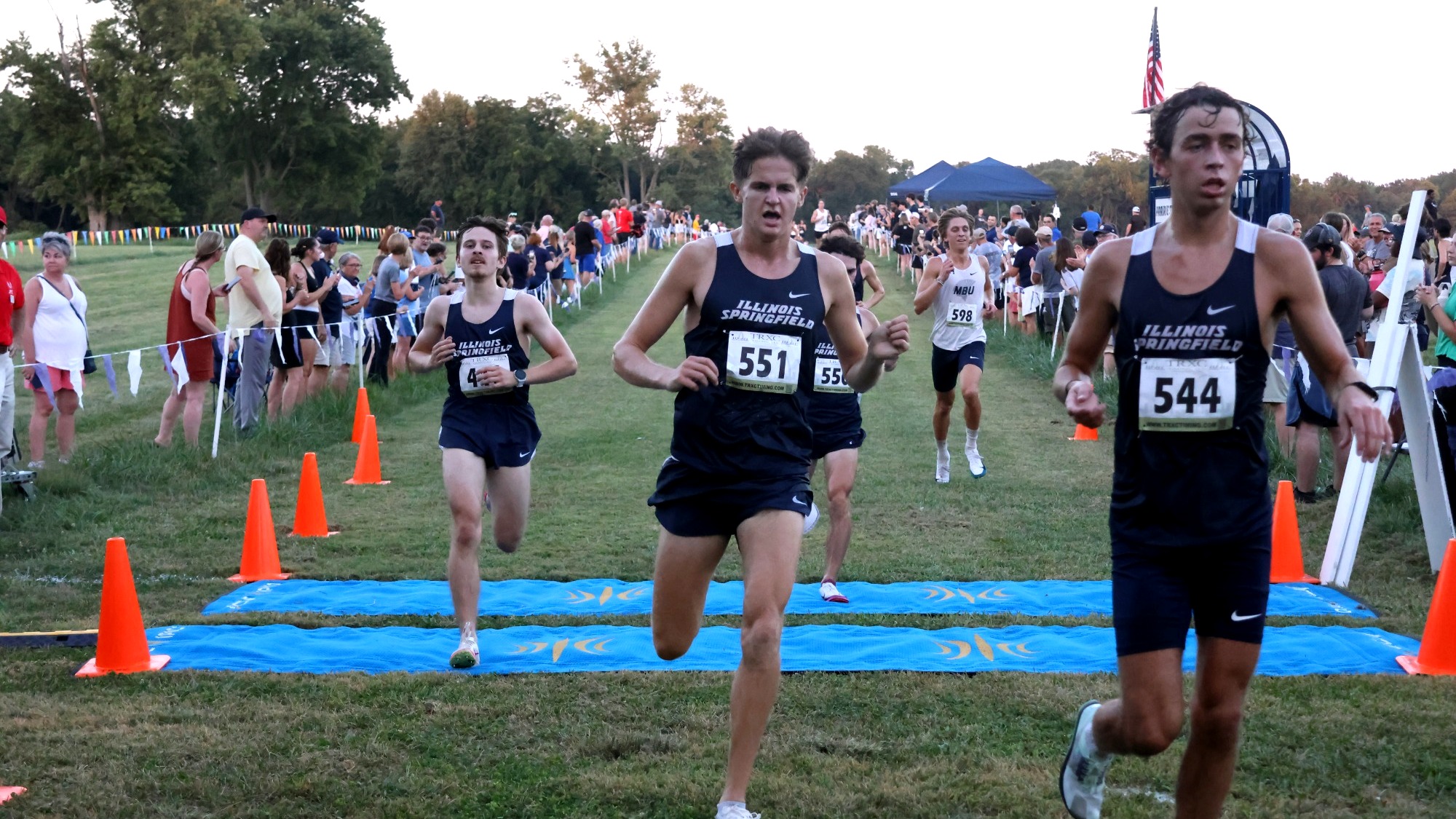 UIS Cross Country athletes crossing the finish line