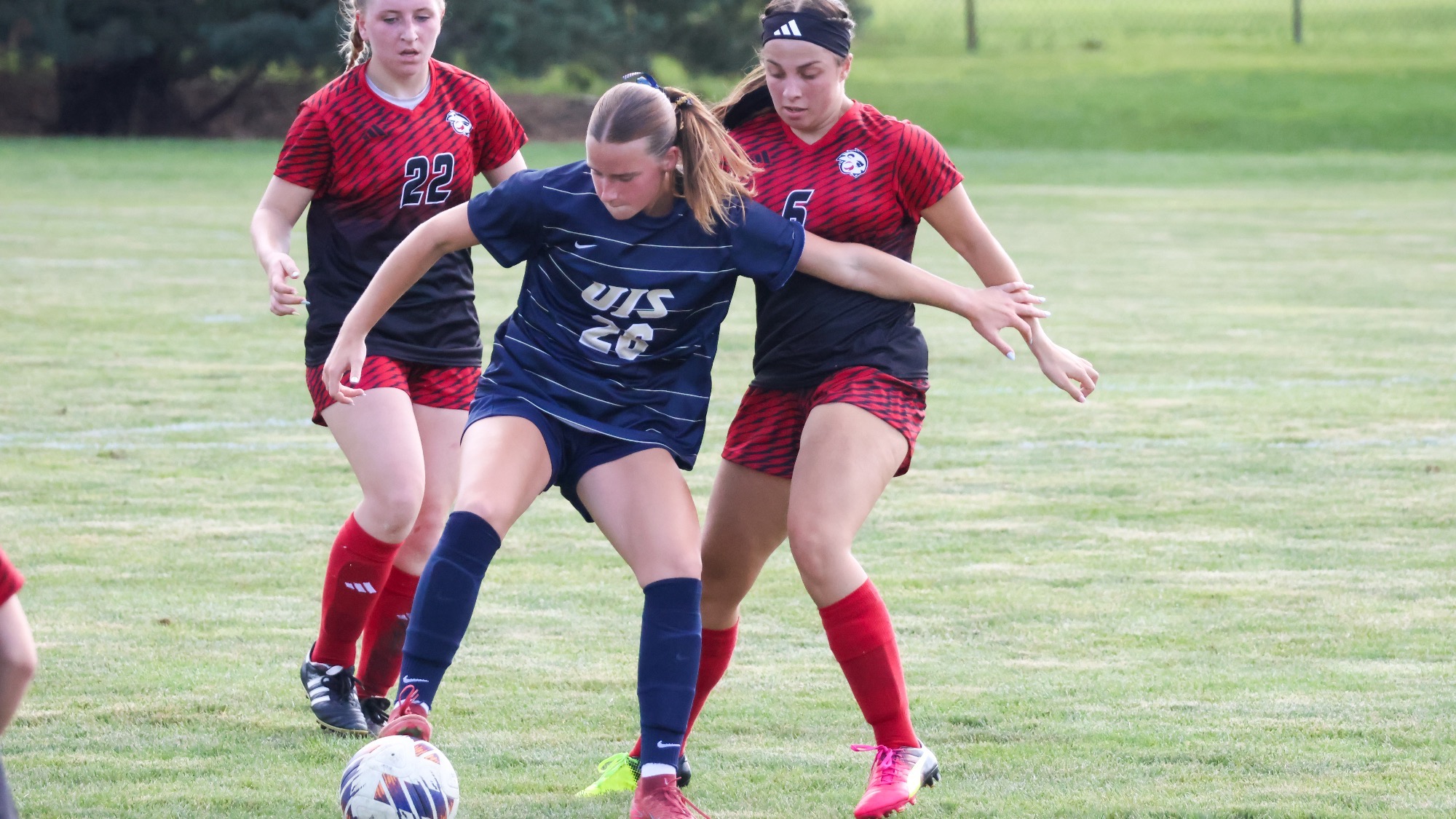 Elyse Severson playing soccer in UIS blue