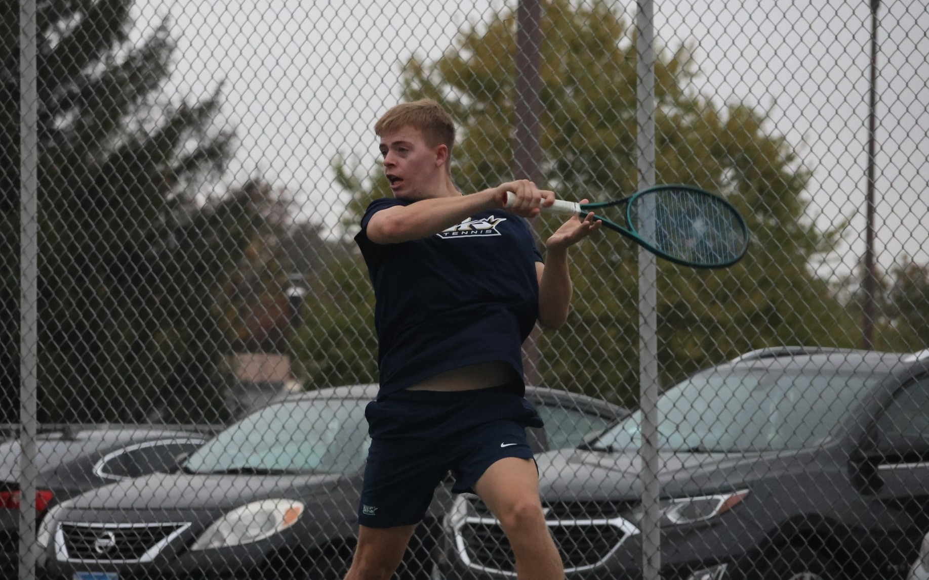 Luke Pennington playing tennis for UIS