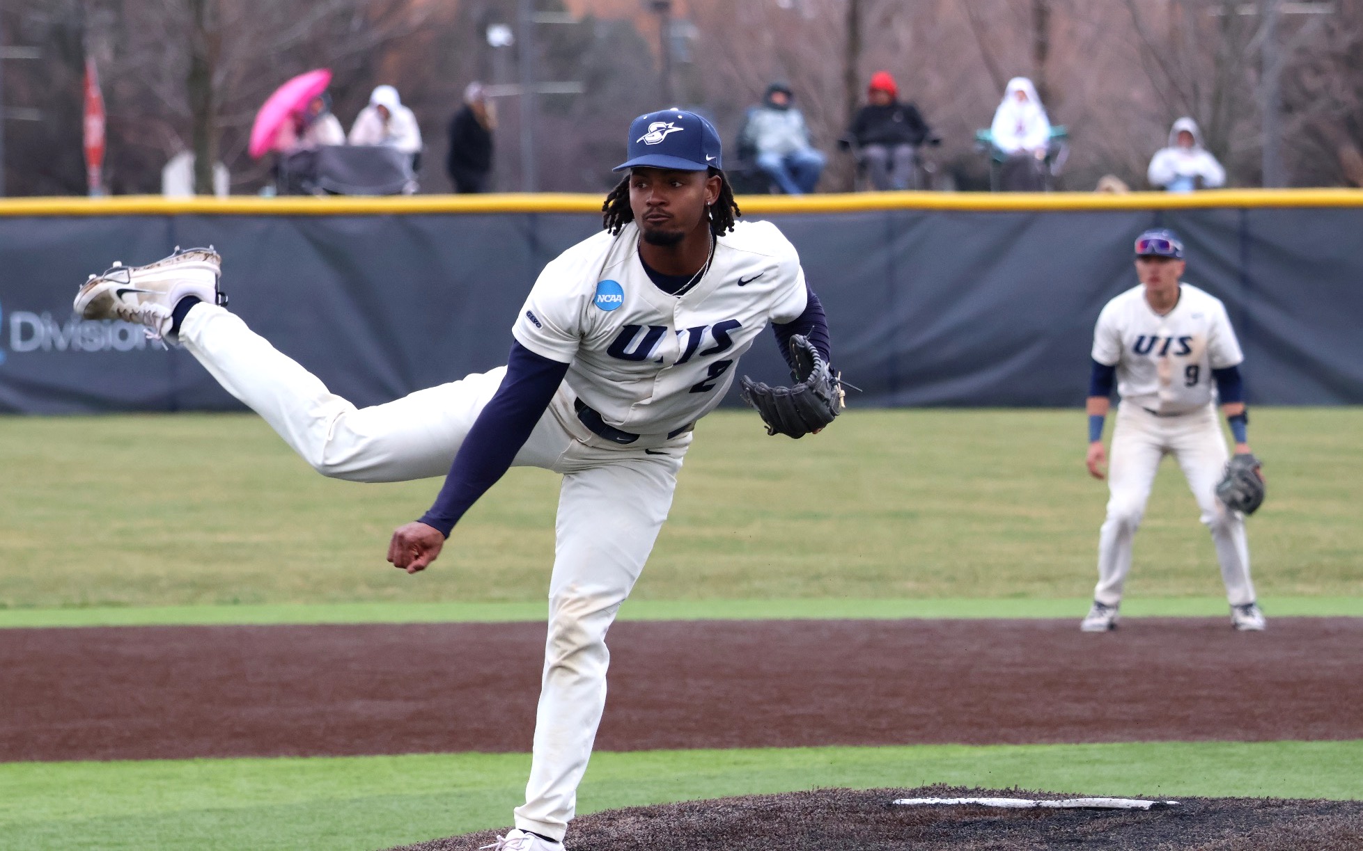 Kyle Tyler pitching in white UIS baseball uniform