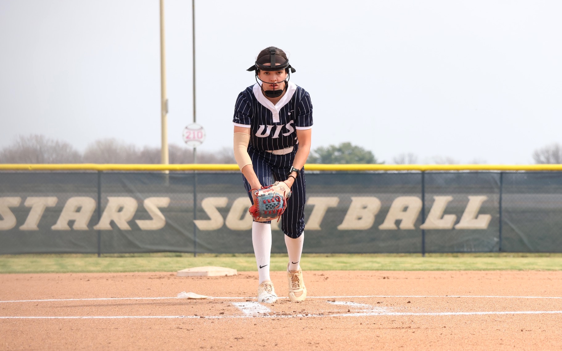 Rosie Bartletti in the circle in blue UIS uniform