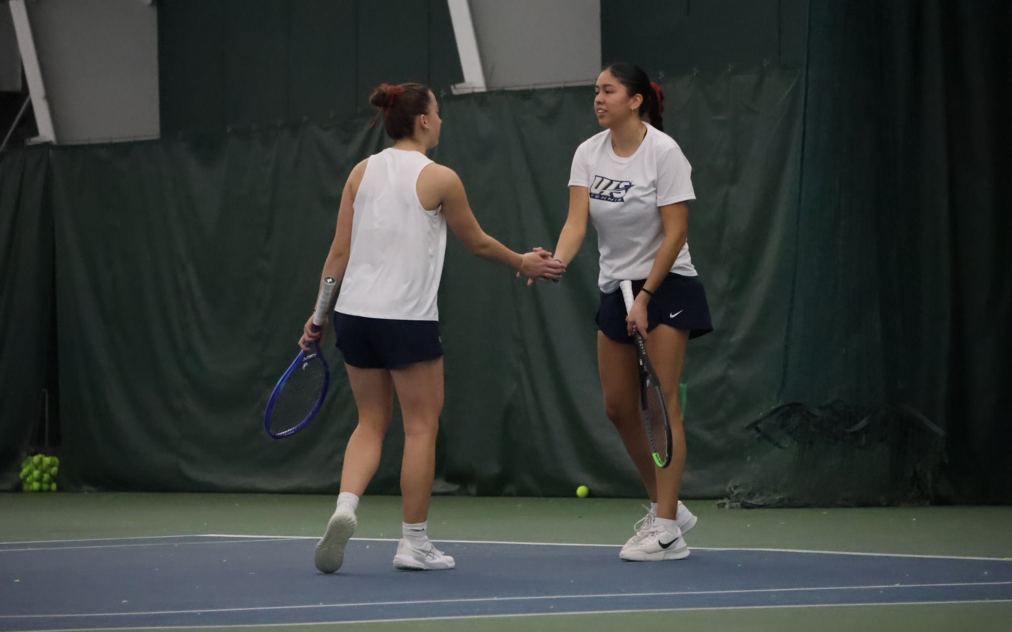 Cristina Mendoza Romero and Jane Carter playing tennis