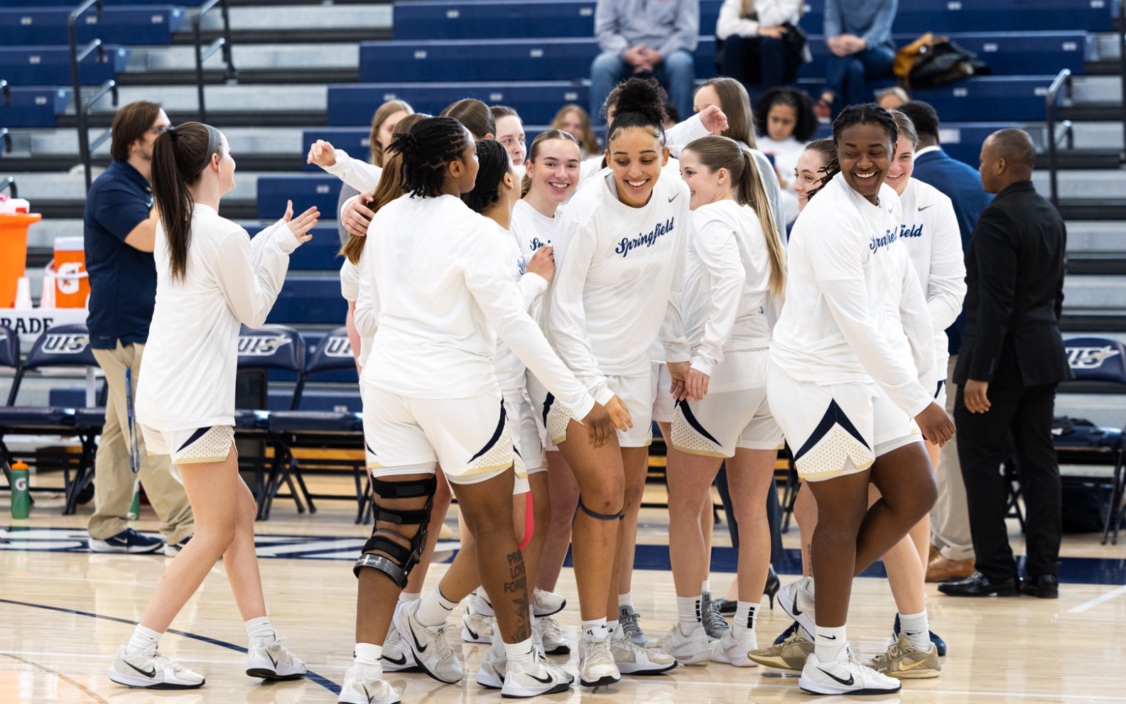 Women's basketball celebratory huddle