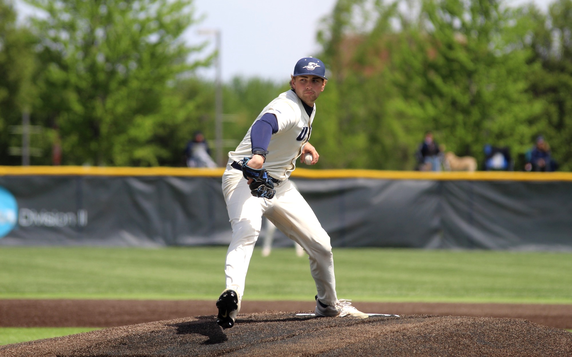 Graham Kasey pitching in white UIS uniform
