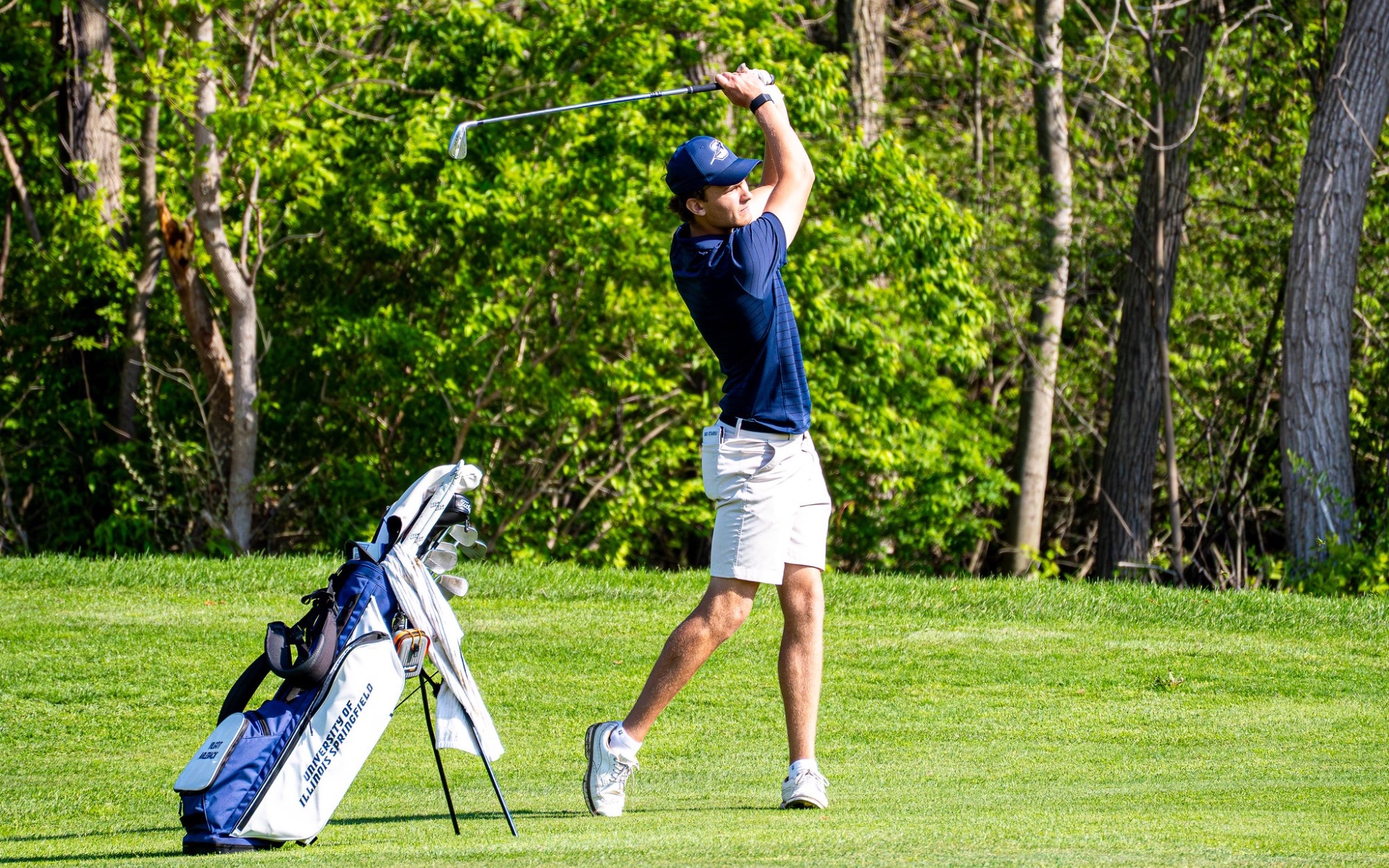 Vilgot Arleback playing golf in blue UIS polo