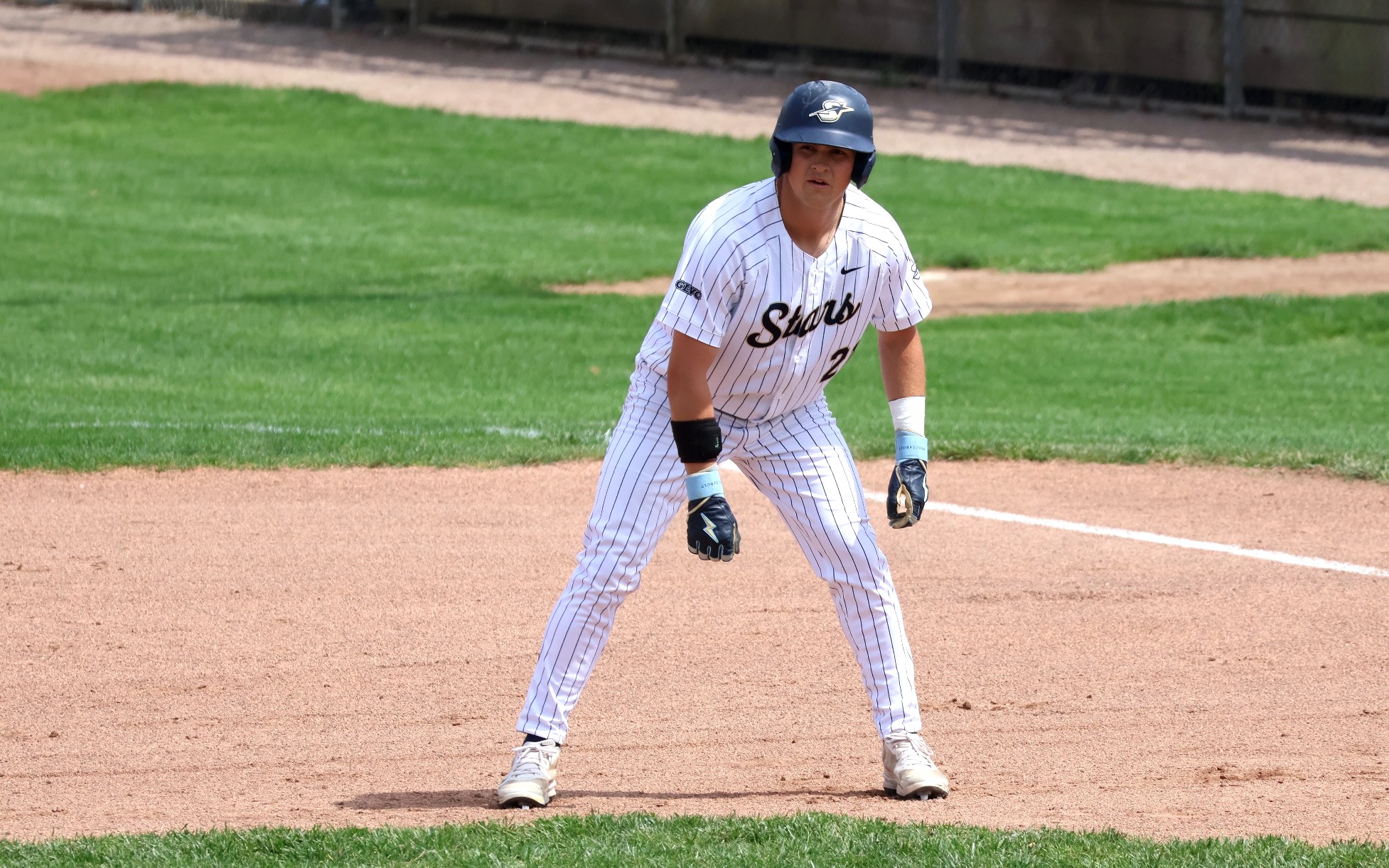 Corey Boyette base running in white UIS uniform
