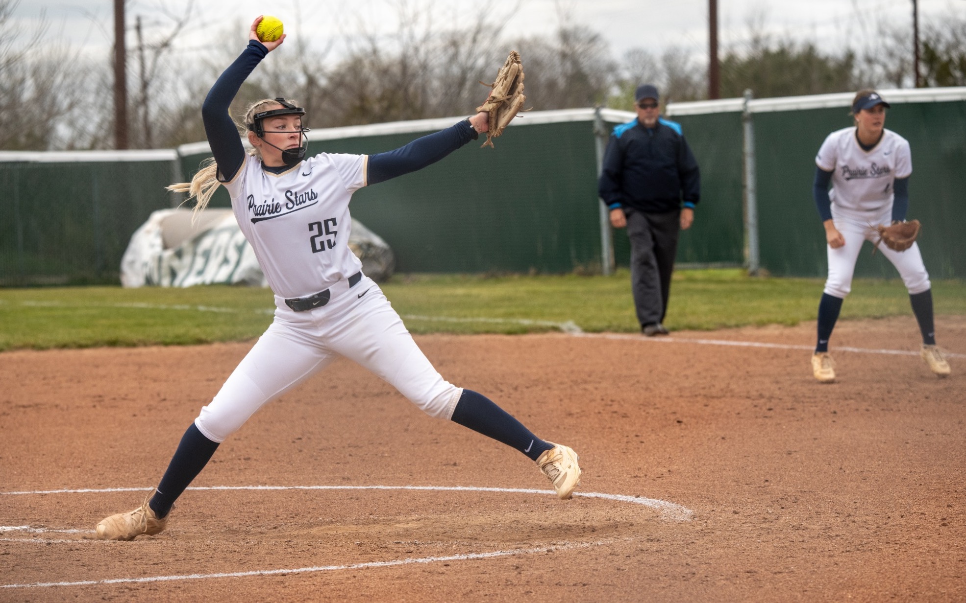 Calista Stahlhut pitching in white UIS uniform