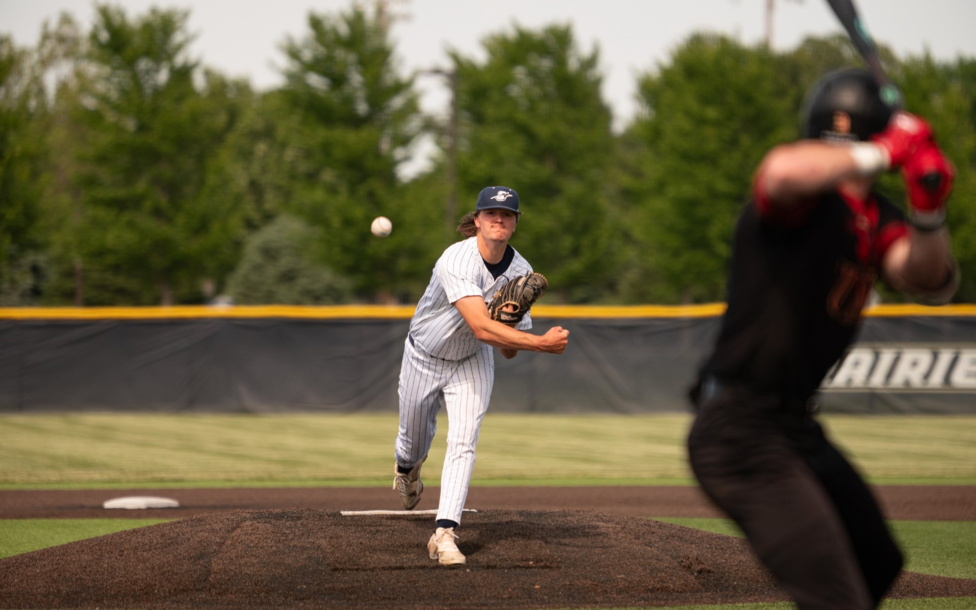Ben Benoit pitching to UMSL batter at UIS