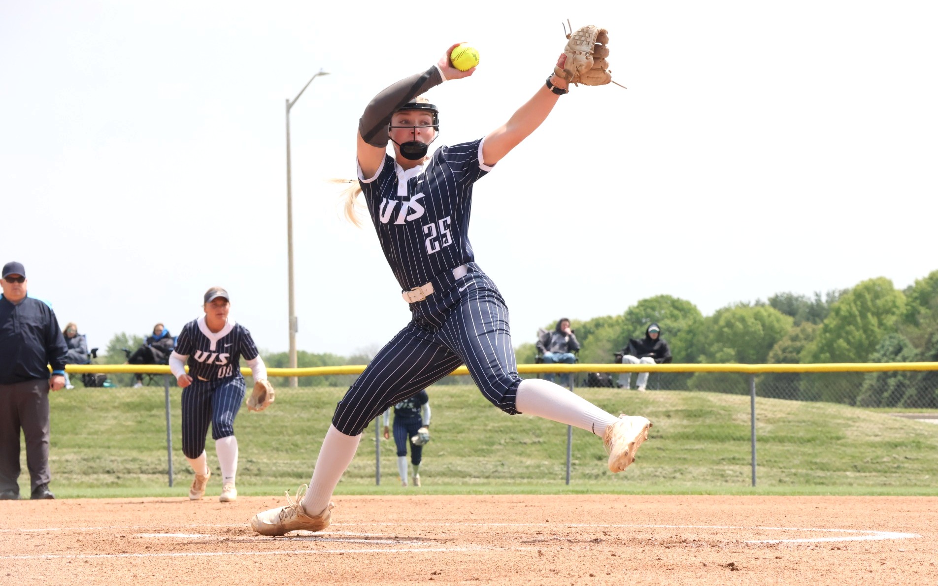 Calista Stahlhut pitching in blue UIS uniform