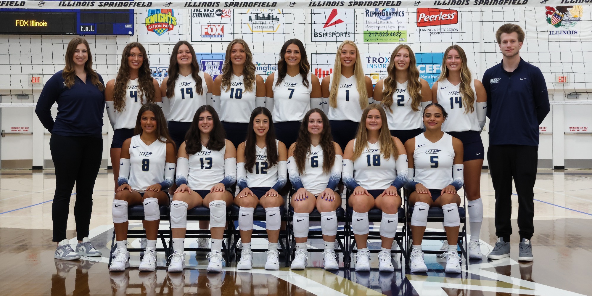 2026 UIS Volleyball team photo on court with coaches