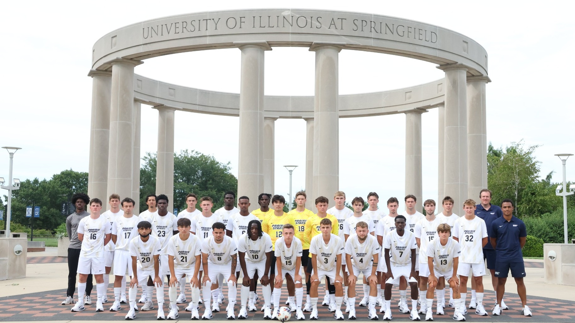 2026 UIS Men's Soccer team photo of student-athletes and coaches in front of the UIS Colonnade