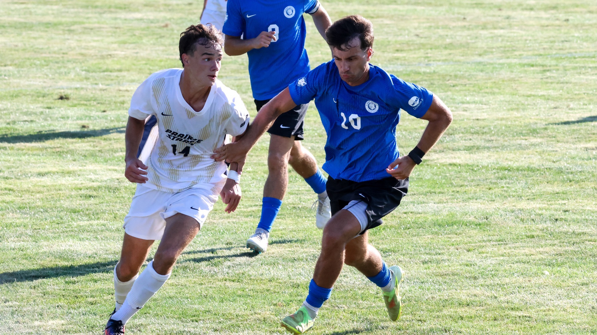 Liam McLean playing soccer at UIS in white Prairie Stars jersey