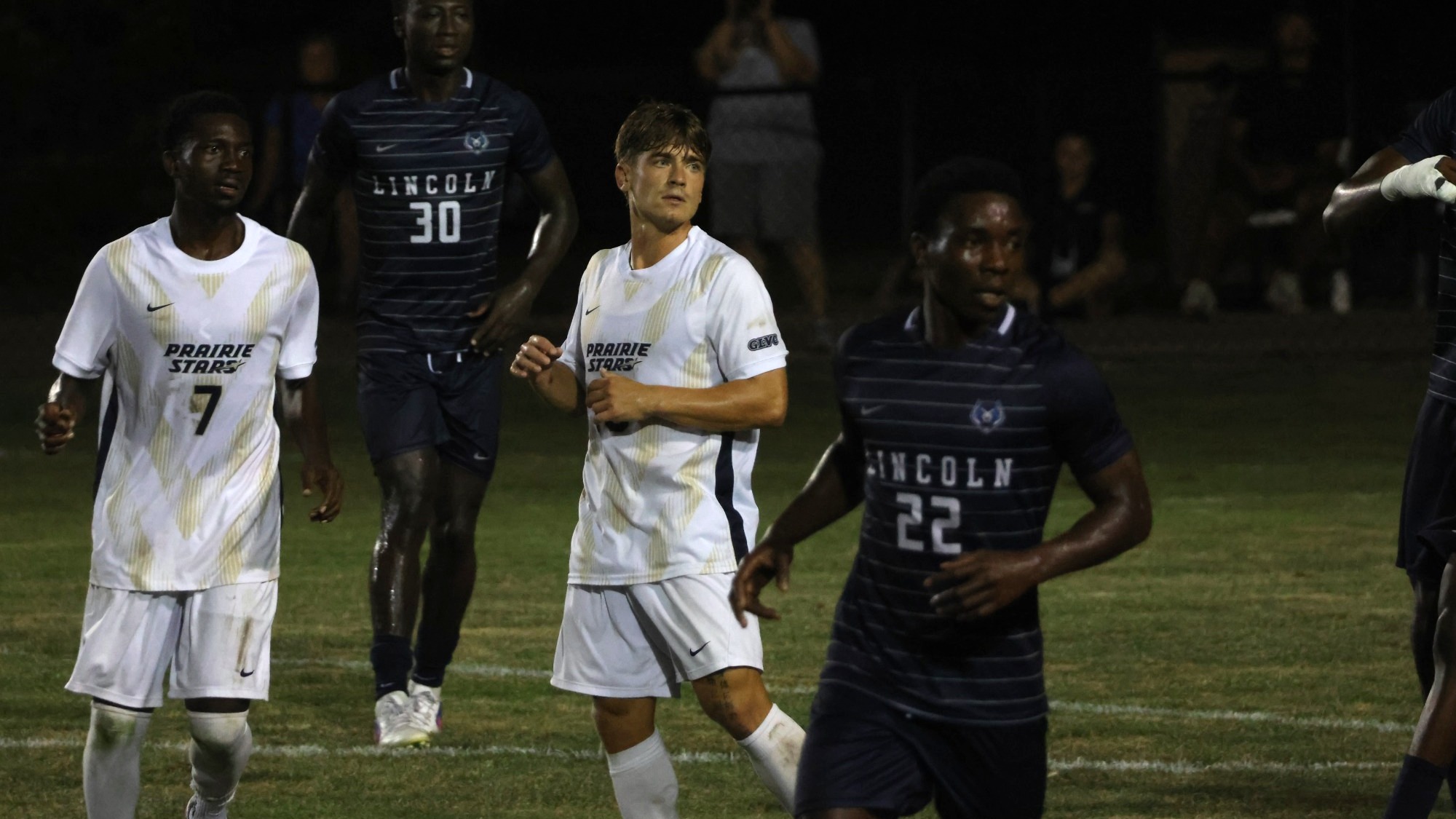 Carter Downen and Gentil Selemani on soccer field
