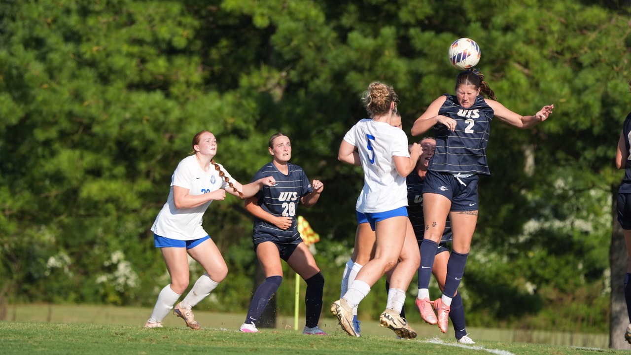Kalli Drexler heading a soccer ball