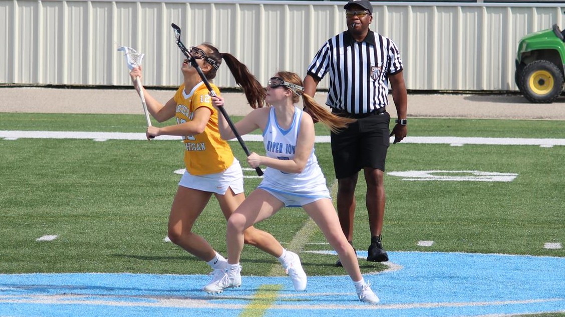 Bailee Fabert after a faceoff with Northern Michigan