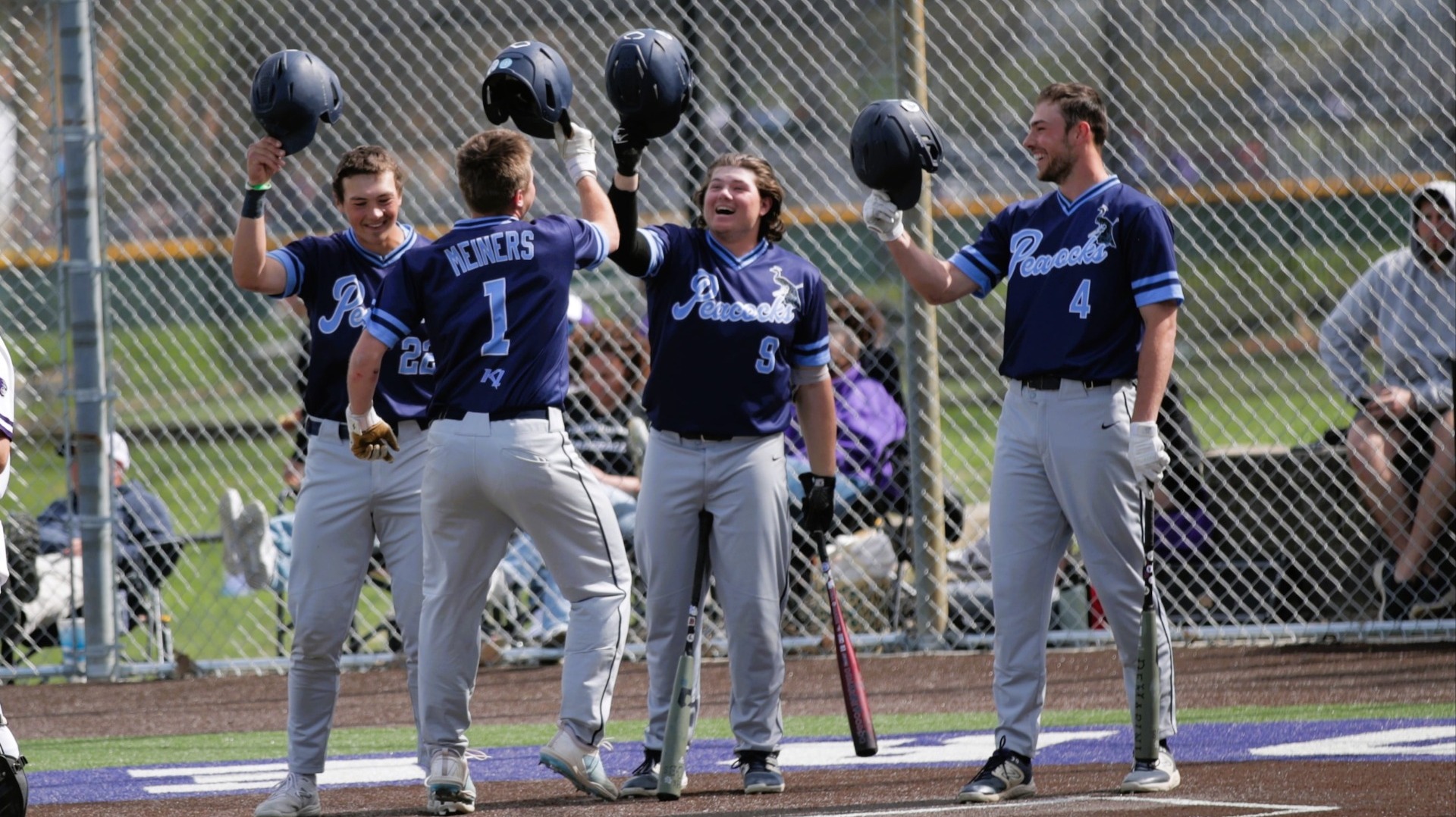 Baseball boys celebrate a home run and victory in extra innings