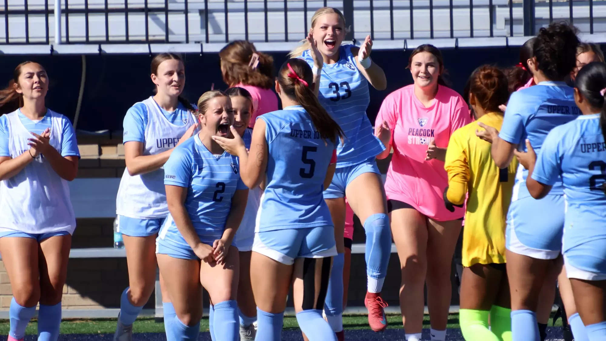 Mimi Moore and Aubrey Carlson getting excited before playing Drury 10/11/26