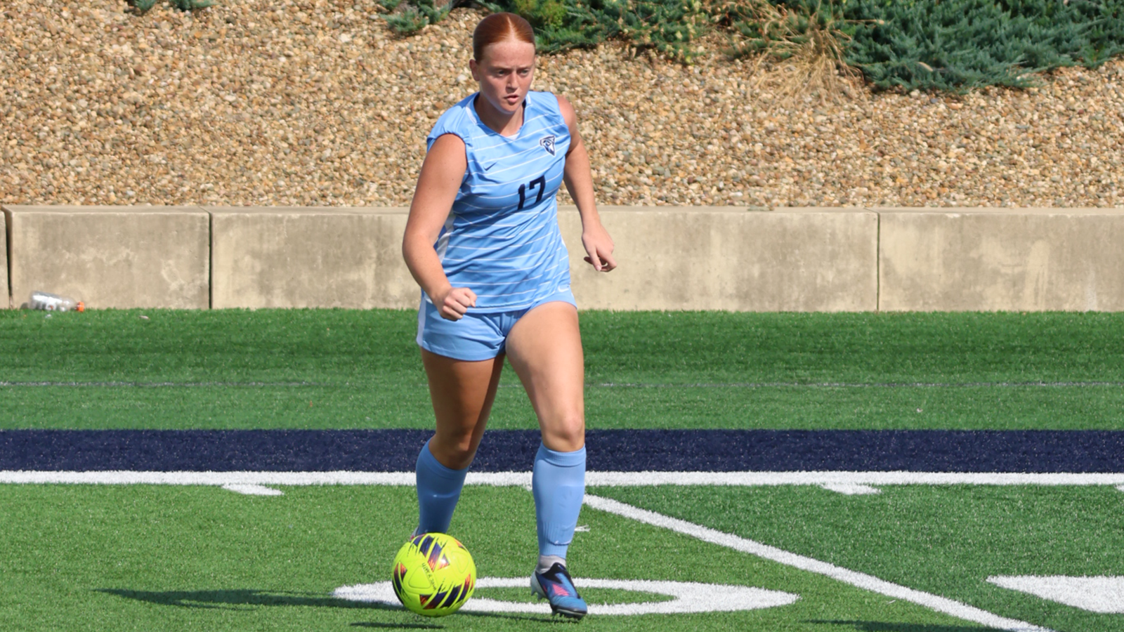 Maryn Hudson dribbles the soccer ball vs. Roosevelt 2026