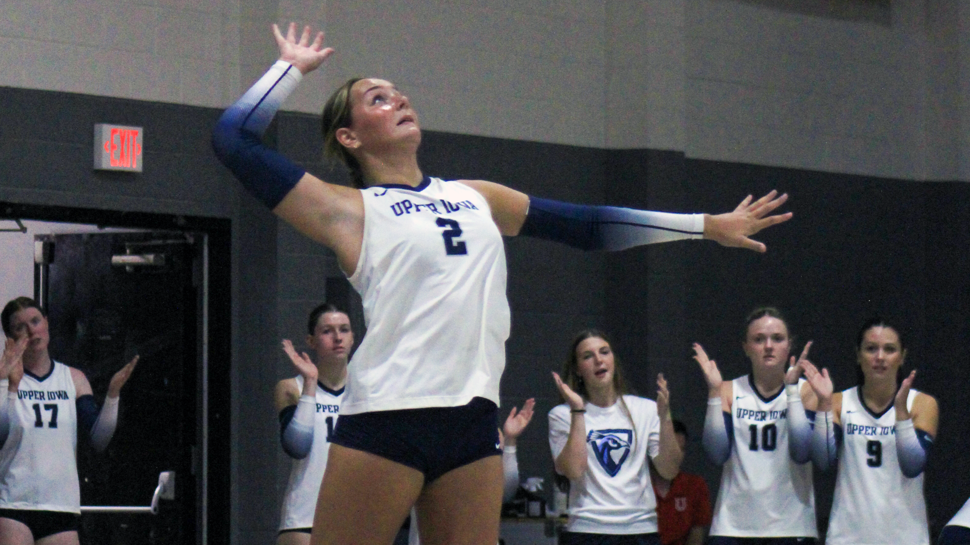 Natalie Bystol serving vs. Lane College 2026