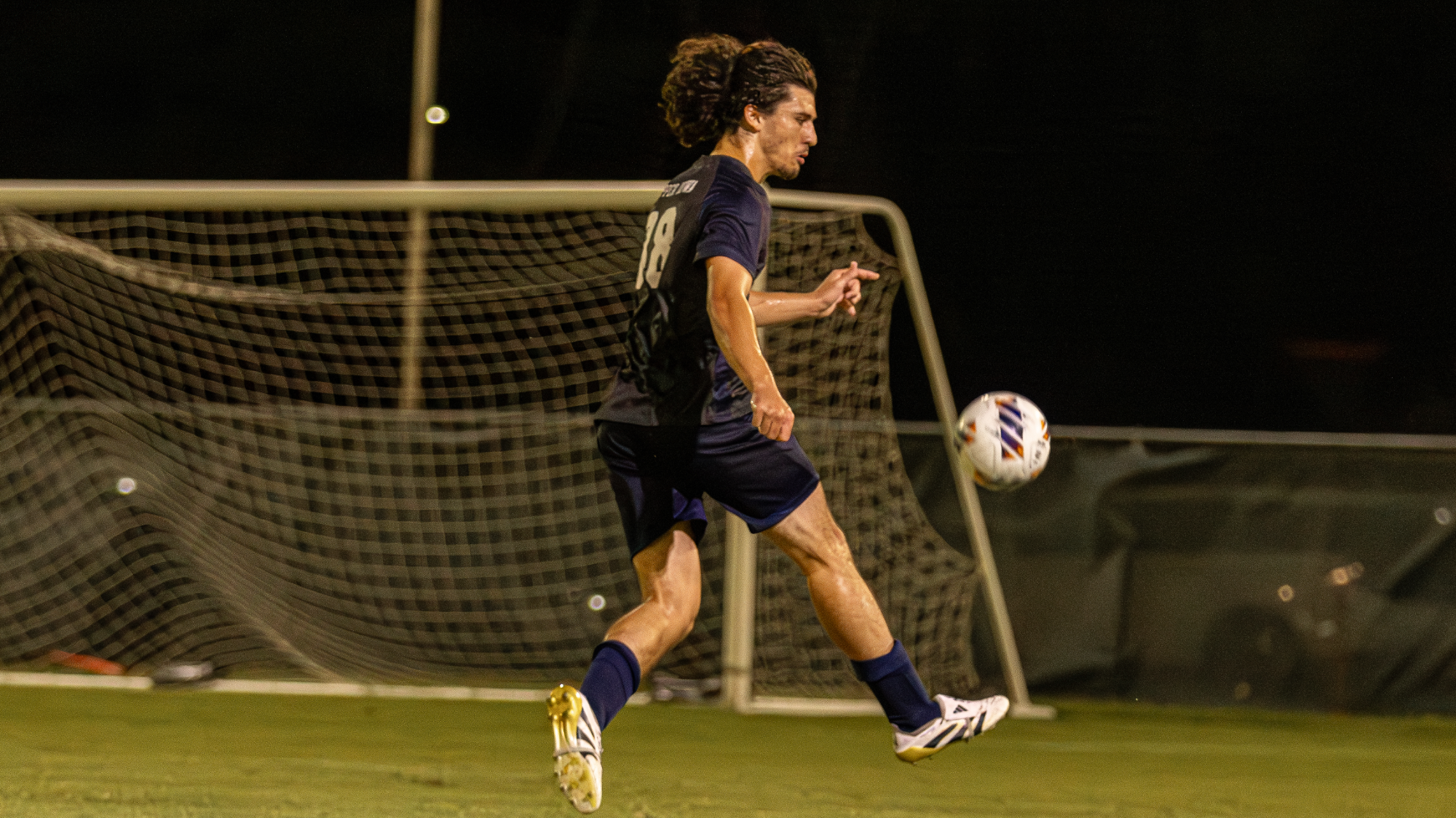 Rayan Lafon kicking the ball vs Missouri S&T