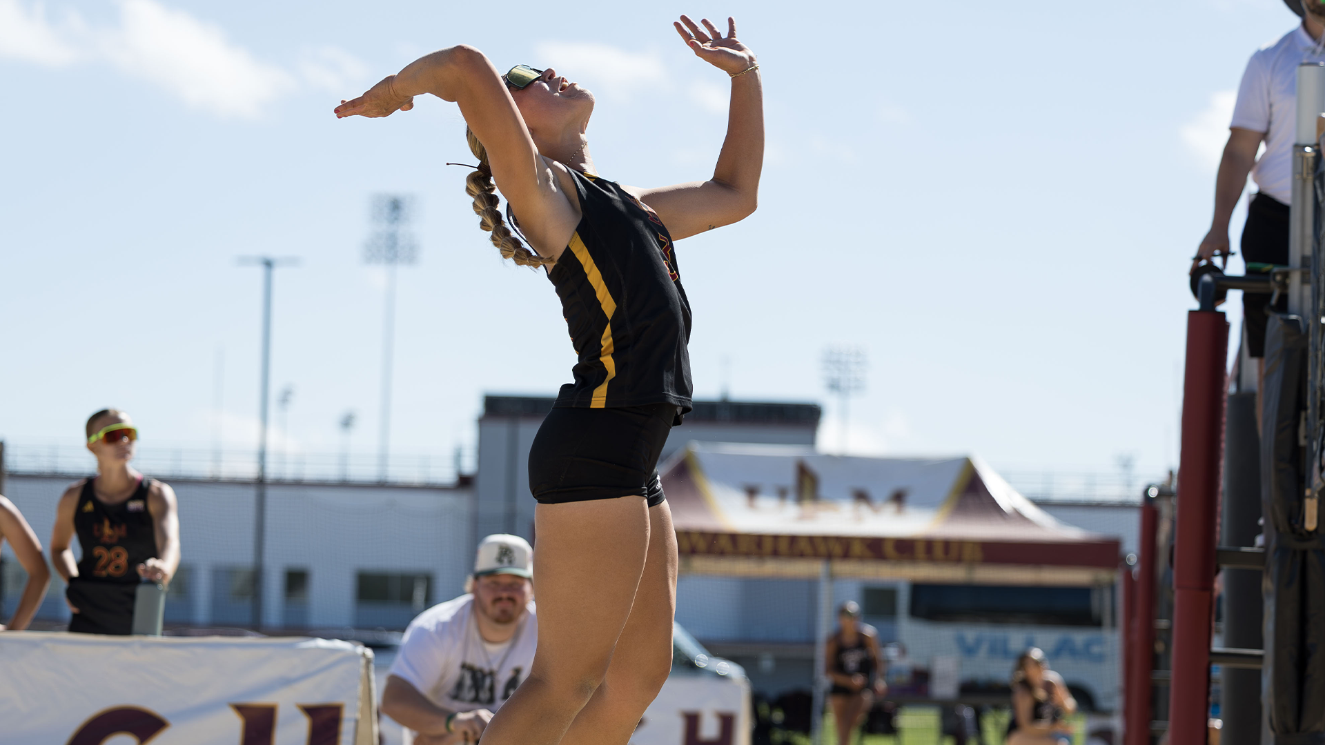 Abby Ryno prepared to hit the ball in a beach volleyball match
