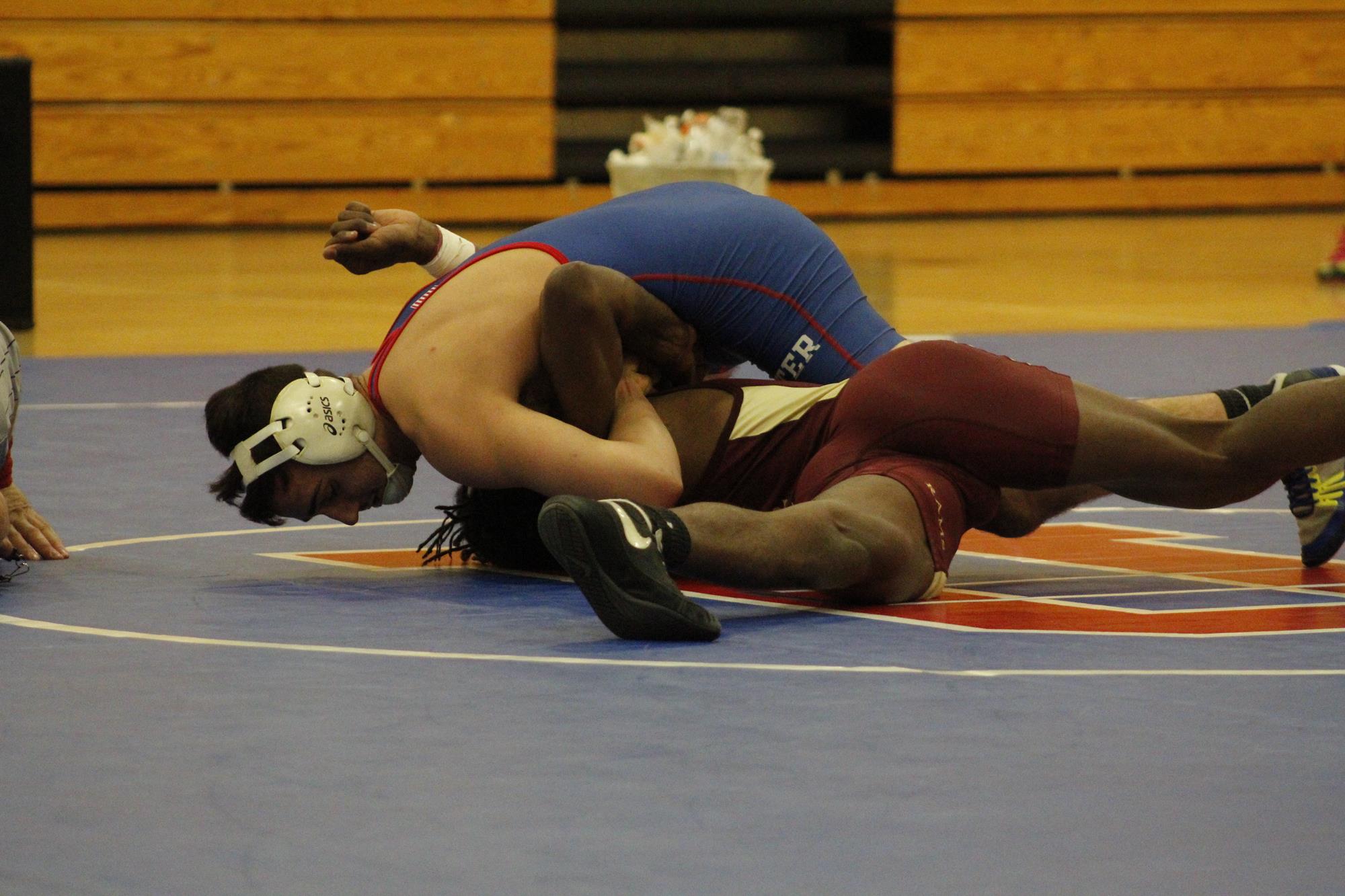 Wrestler Pinning Opponent