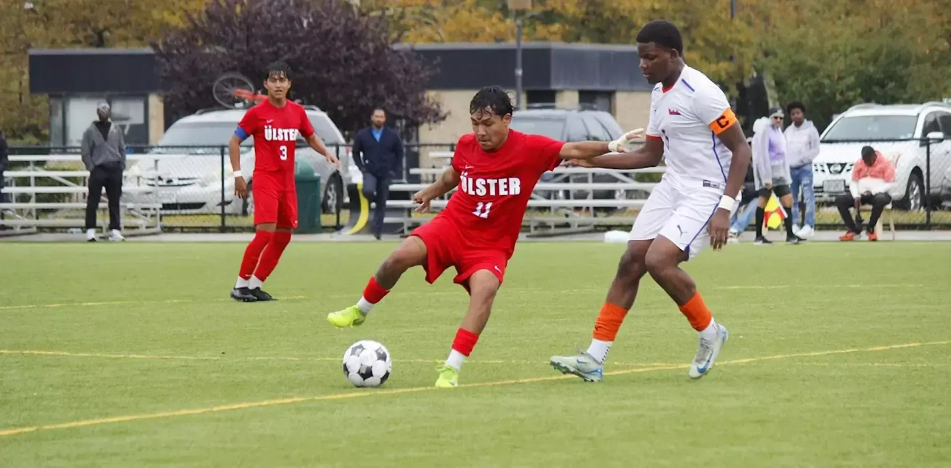 Antony Pesantez #11, Angel Rosario #3 in background
