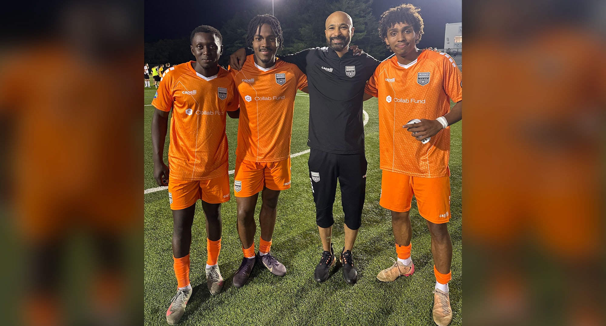 three soccer players with coach