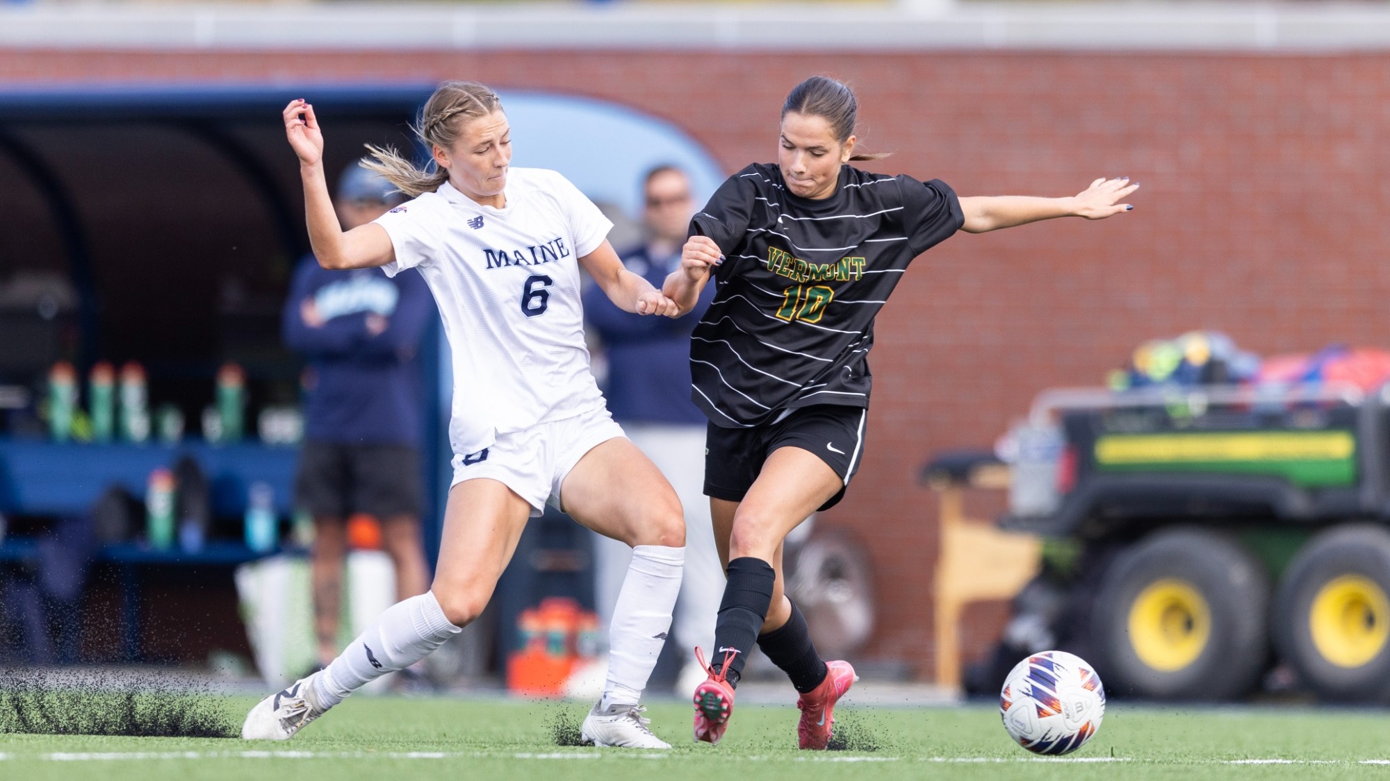 Victoria Dungey and a Vermont player battle for the ball.