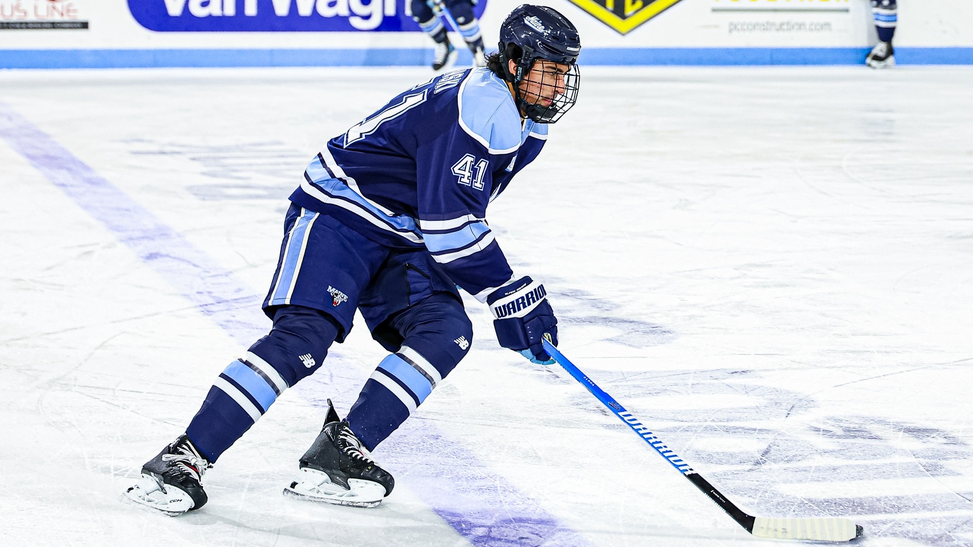 Jaden Lipinski enters the offensive zone with the puck.