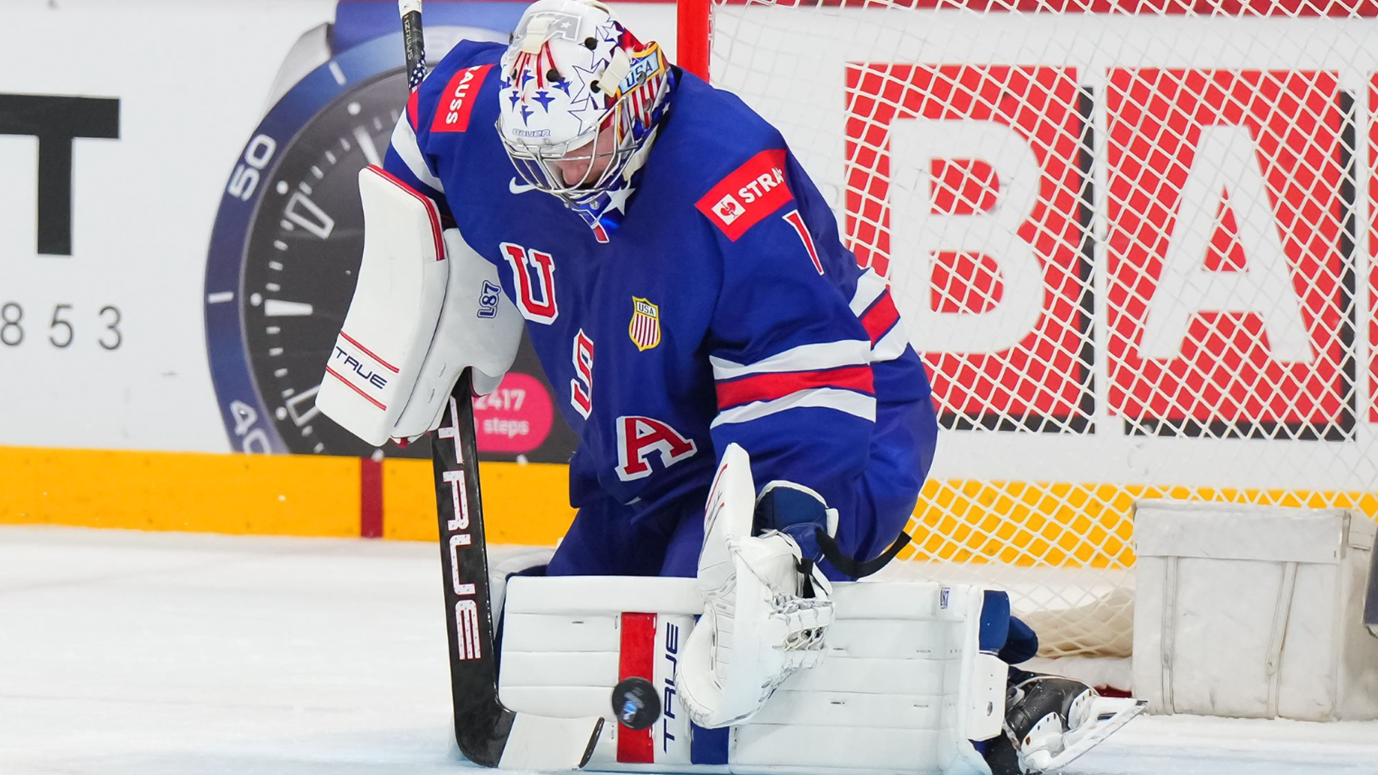 Jeremy Swayman makes a save.