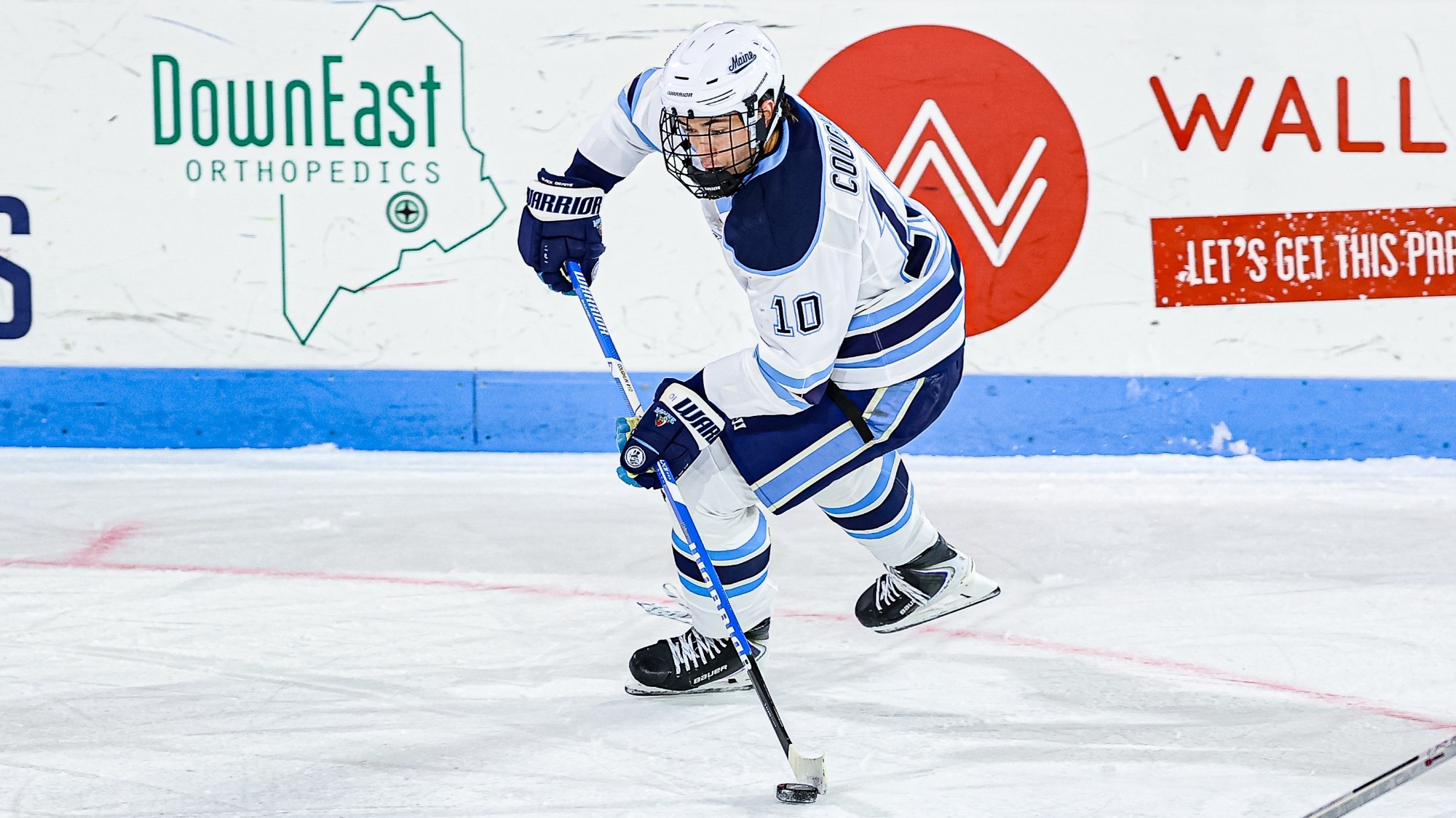 Luke Coughlin carries the puck.