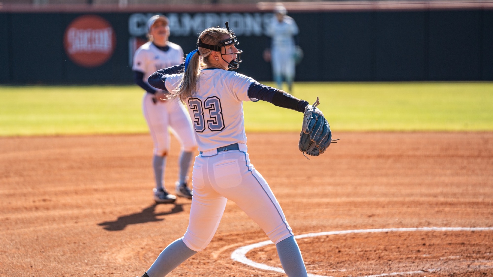 Alysen Rieth throws a ball to first.