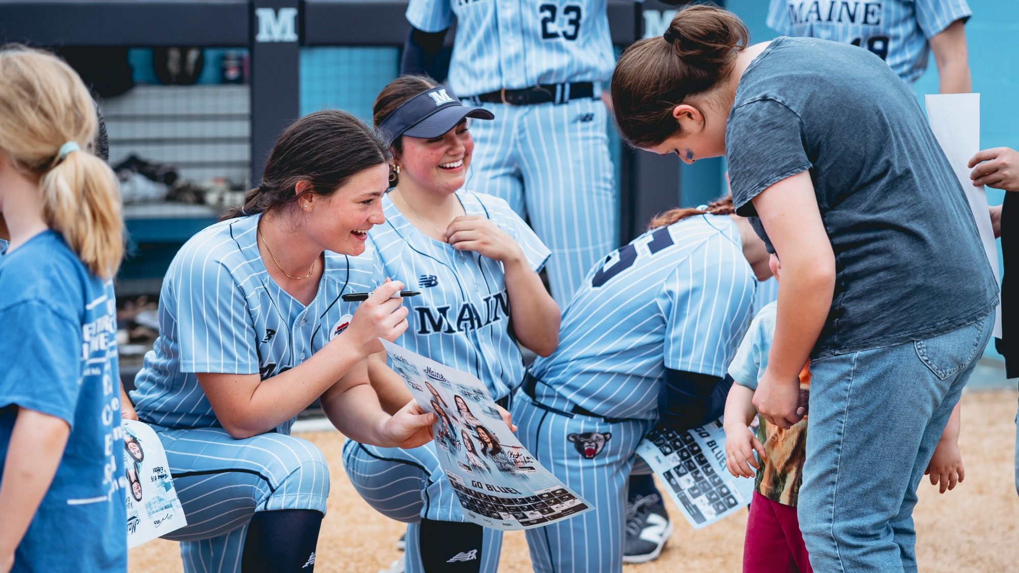 Keira Inman signs an autograph.