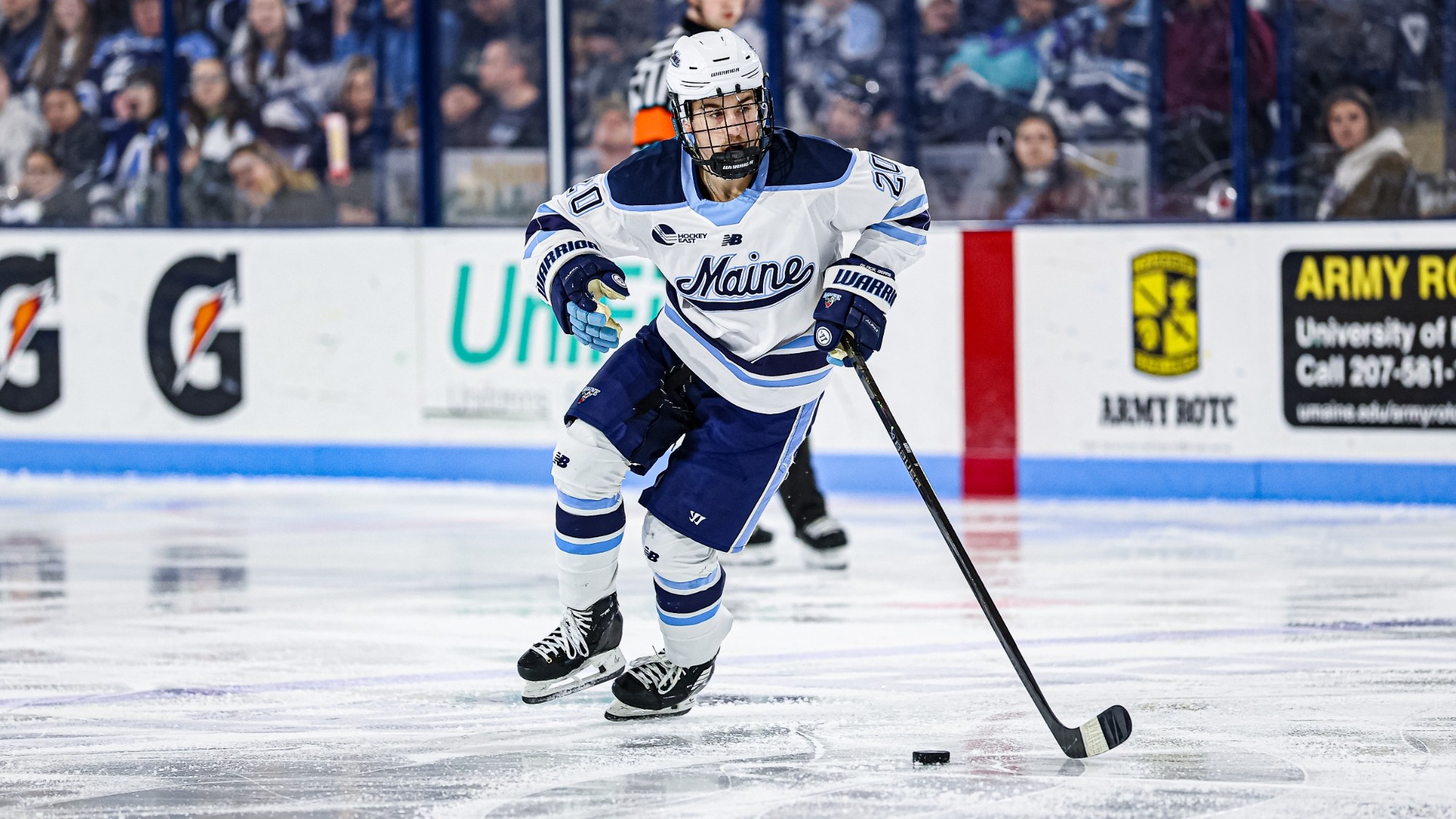 Josh nadeau carries the puck up the ice,