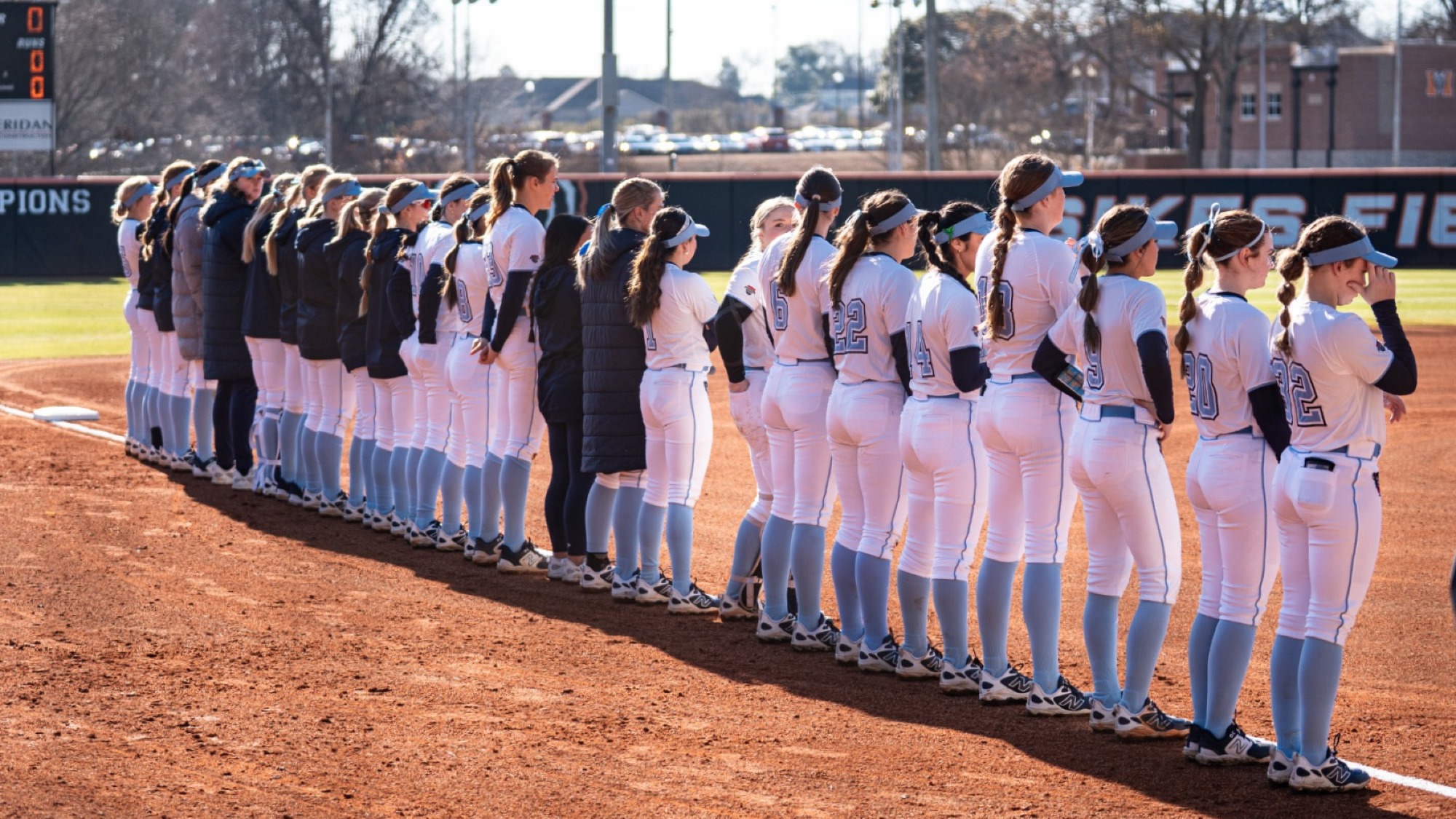 Maine softball stands on the third baseline pregame.